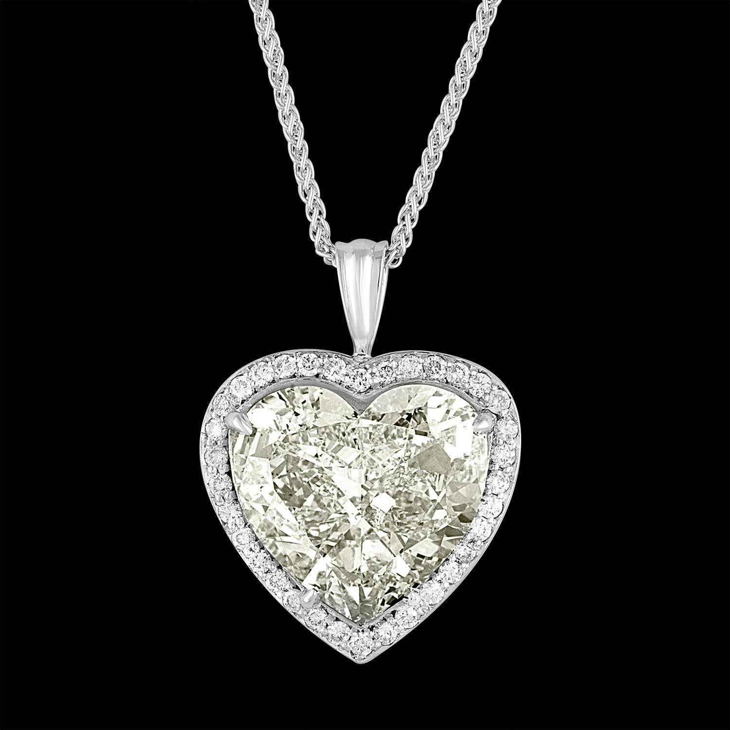 A 7.05 Carat Heart Shape GIA certified as J in Color and VS2 in Clarity is set in 18K White Gold Pendant with 0.44 Carat Total Weight of small Diamonds around it.
GIA certificate # 2165160290