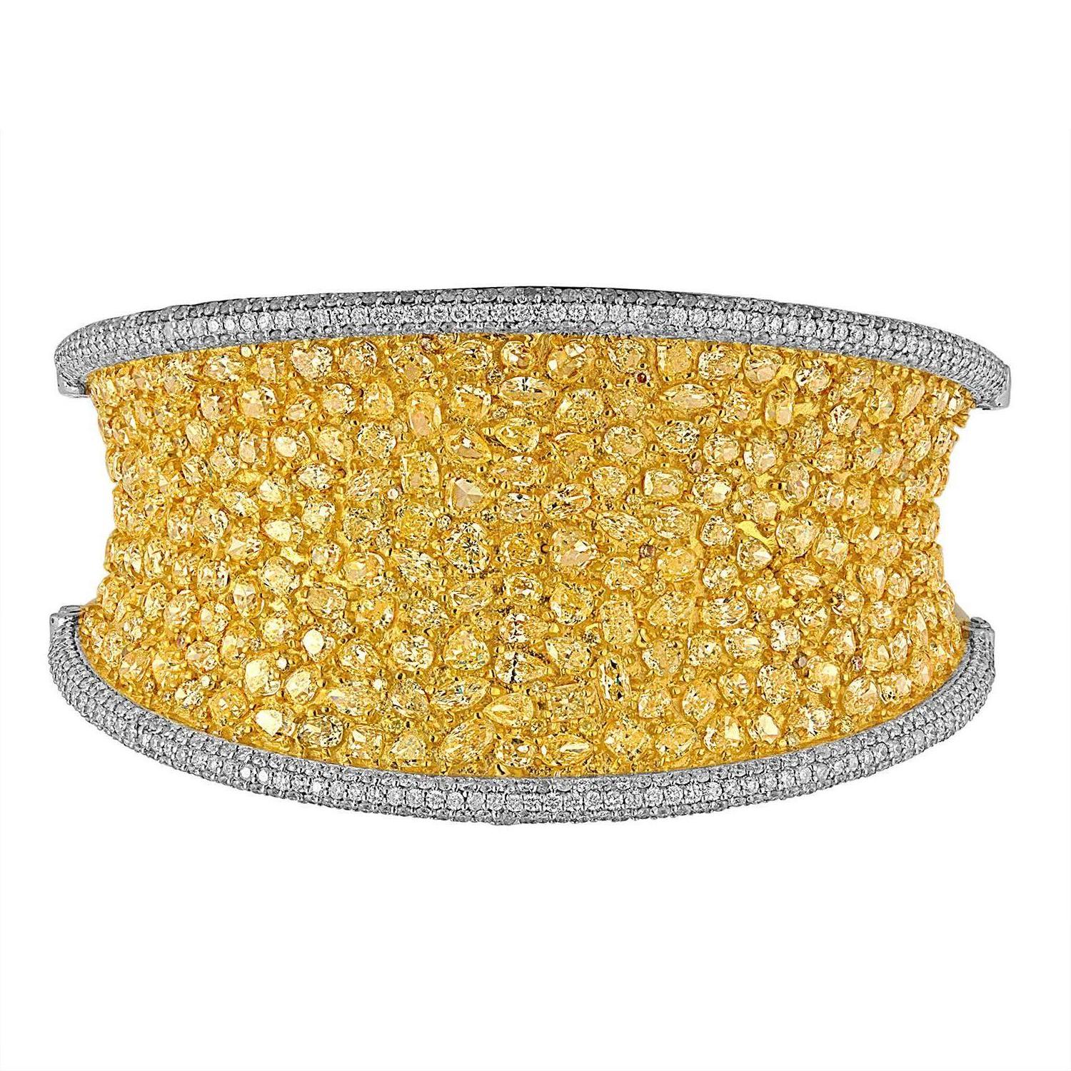 200 Fancy Shaped Yellow Diamonds are set in Yellow Gold with White Melee.
The approximate 1.5
