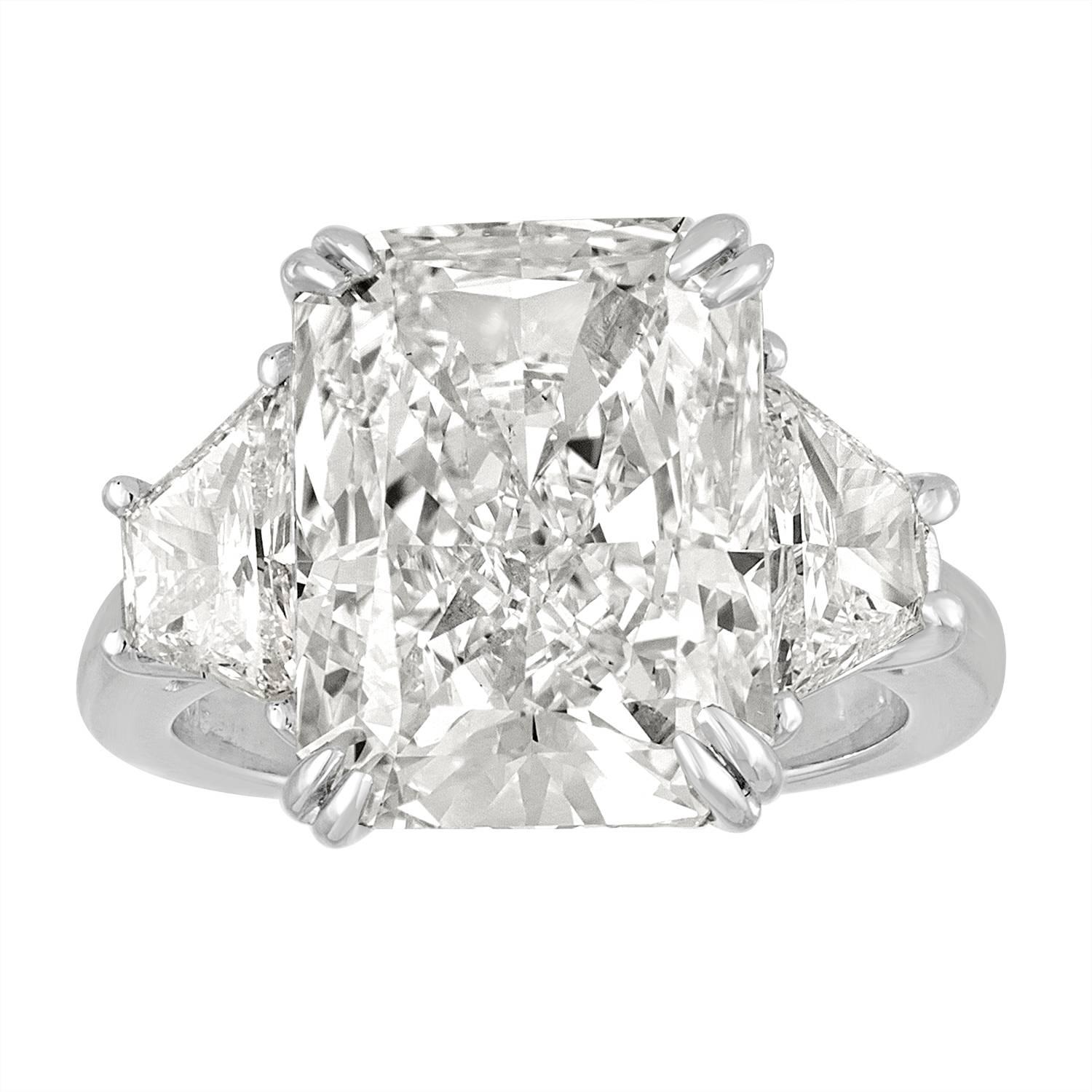 Hand crafted Ring Mounting for this Beautiful Rock. This 9.32 CT Radiant Diamond is GIA certified as K in Color and VS2 in Clarity. Mounting is made of Platinum. The 2 Trapezoids are totaling 1.21 Carats. GIA Certificate number is 2165715006.