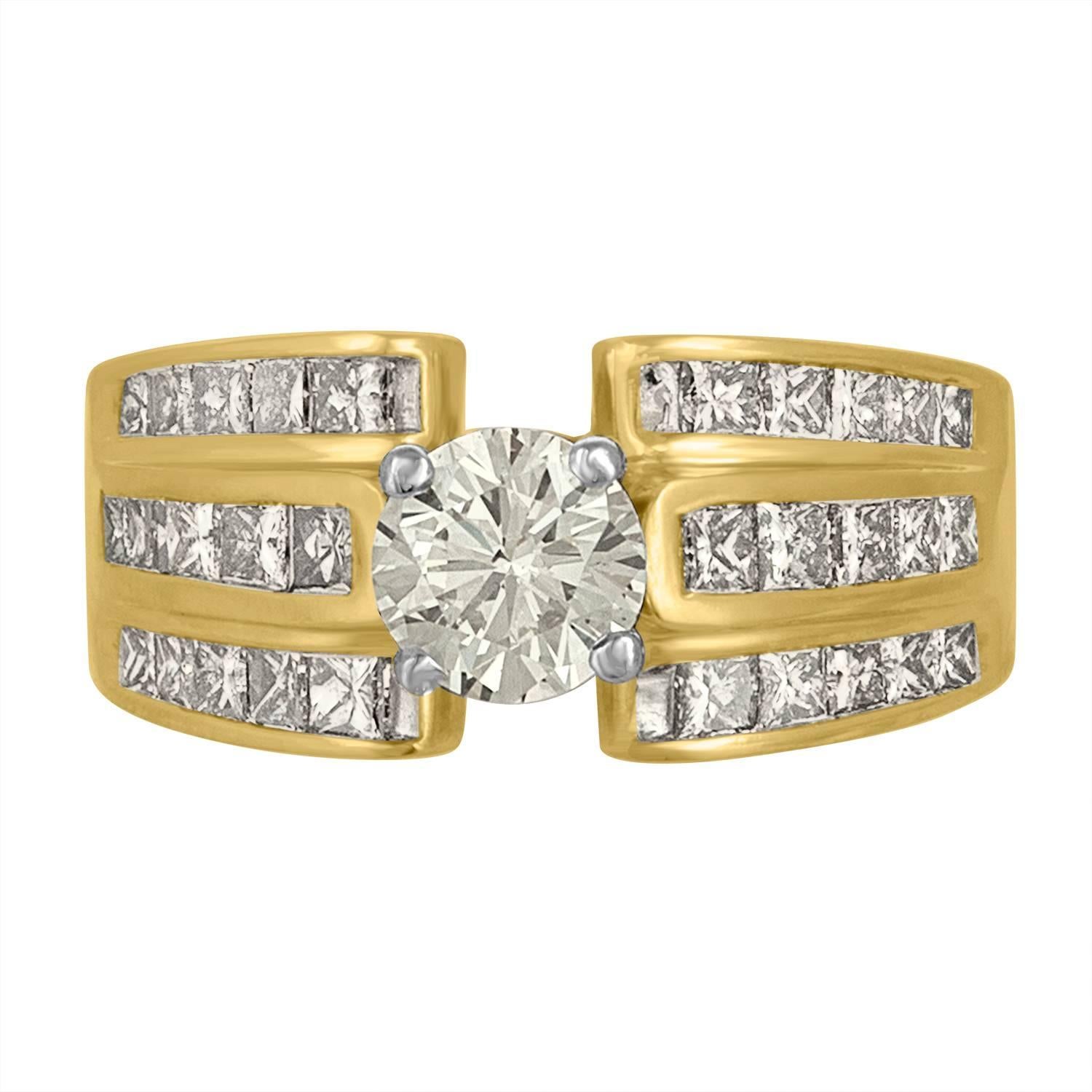 The Brilliant Diamond is set in Two Color Gold Ring Mounting. On the Shank, which is made from 14 Karat Yellow Gold, you can find 30 Princess Cuts Diamonds which are Estimated to be 0.05 Carat Each, Totaling to 2.10 Carats in all.  The Princess Cut