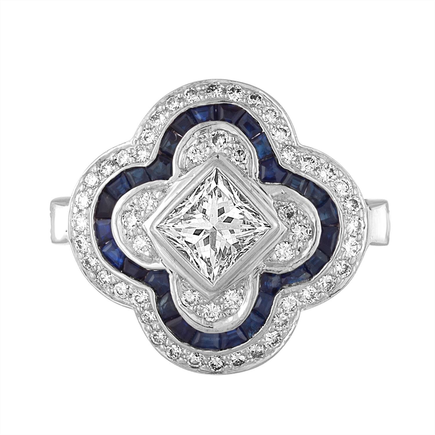 
Classic Combination of Blue Sapphires and White Diamonds. With Different Shapes of Diamonds and Sapphires Creating this Beautiful Flower Ring. 
The Center Diamond is approximate 6mm x 7mm Princess cut Diamond, Estimated to be 1.50 Carat Total