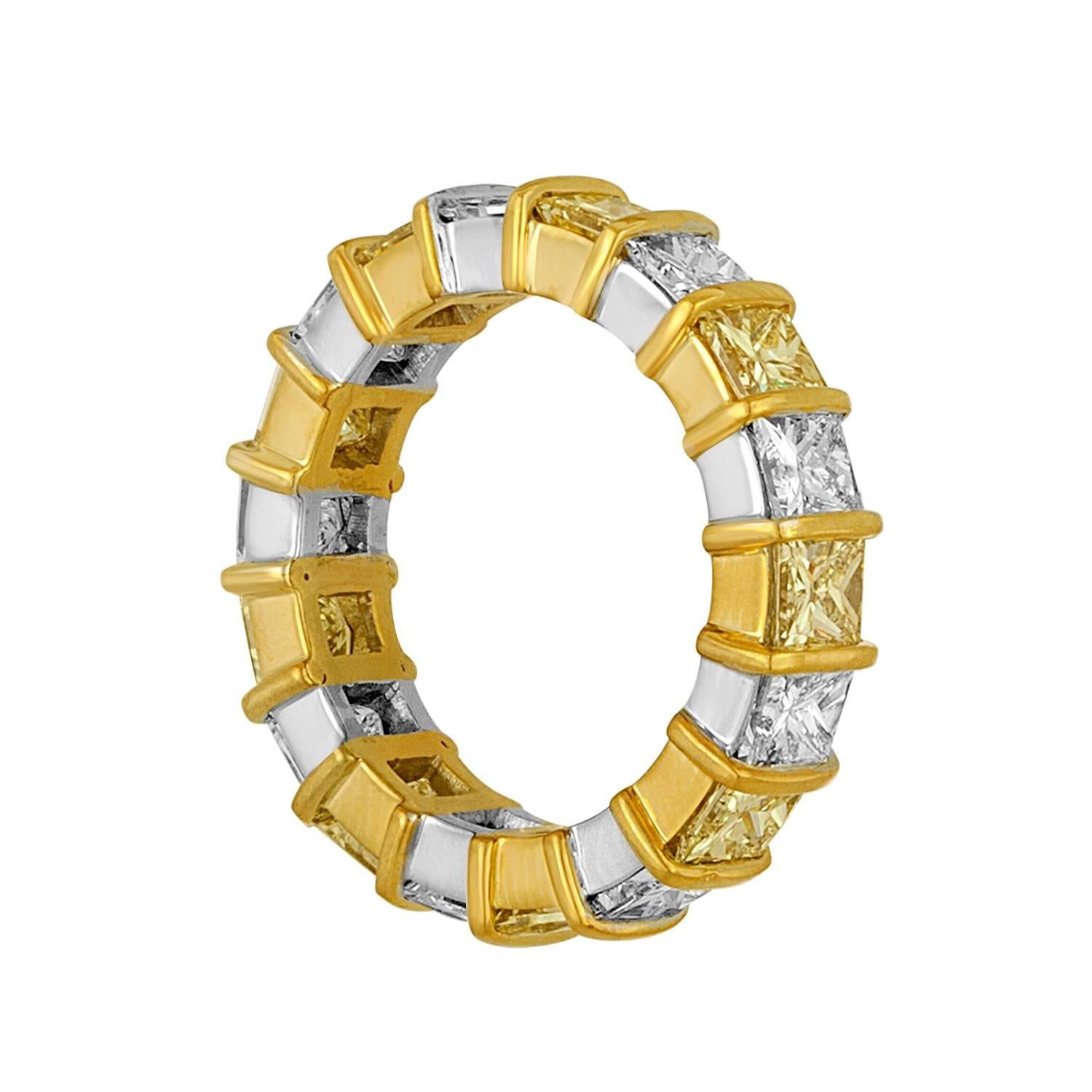 
Nine White Diamonds and Nine Yellow Diamonds are set in Two Tone Mounting as a Wedding Band.
The White Diamonds are Estimated to be G in Color and VS Type Clarity. The White Diamonds are Estimated to be 3.25 Carat Total Weight.
The Yellow
