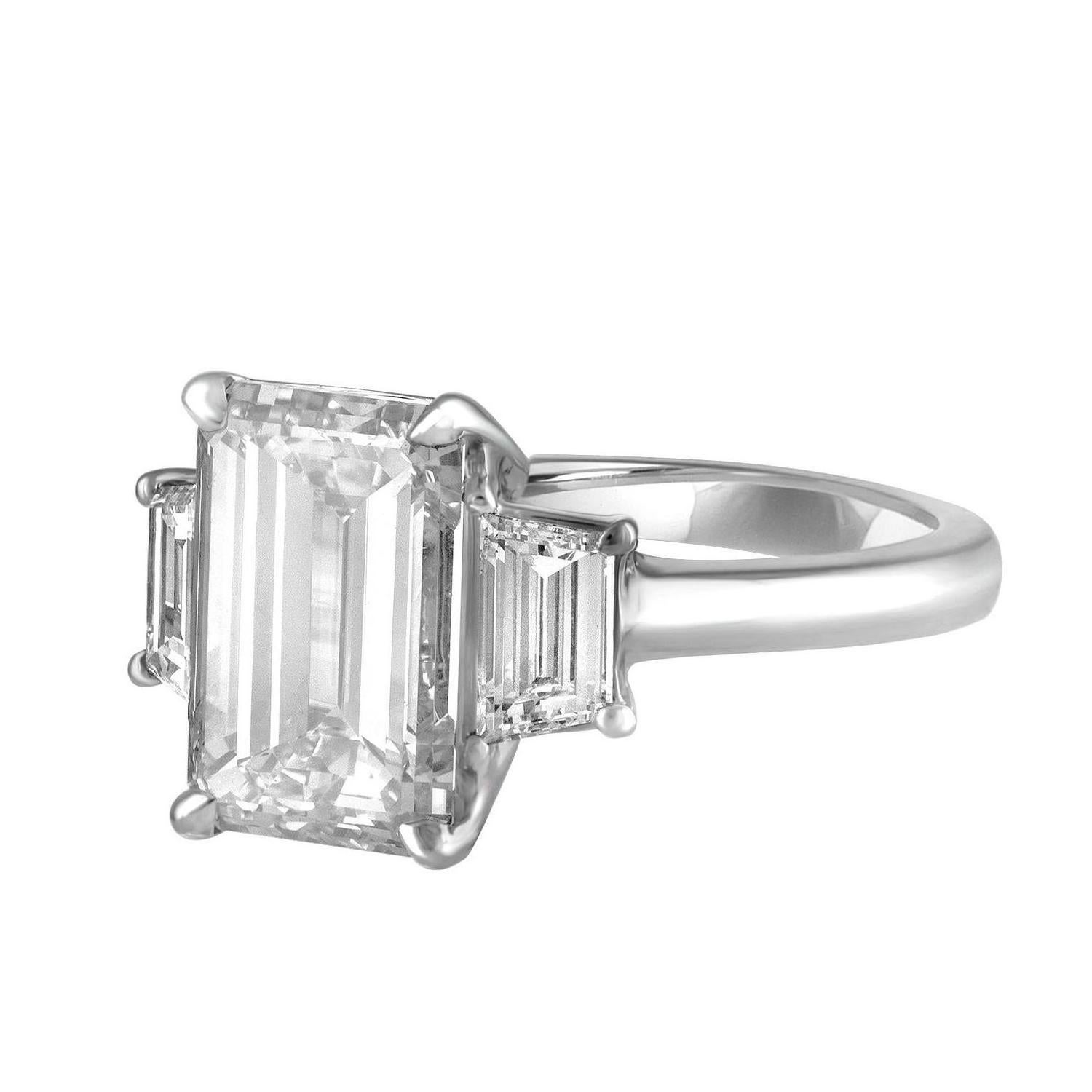 5.01 Carat Emerald Cut Diamond, Certified by GIA to be J in Color and VS2 in Clarity. Certificate Number 6157936307.
 5.01 carat Emerald Cut is set in Hand Crafted Platinum Mounting with Two Step Cuts Trapezoids. Trapezoids are 0.88 Carat total