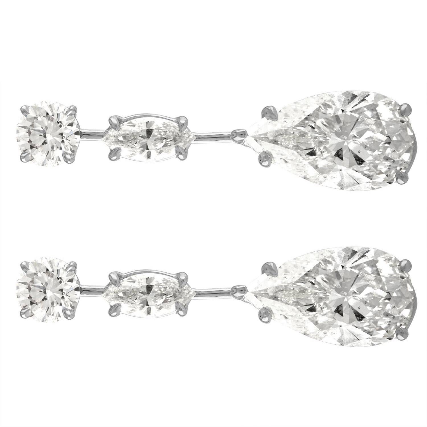 Contemporary 5.02 Carat Pear Shape & 5.23 Carat Pear Shape Earrings Set in Platinum Mounting