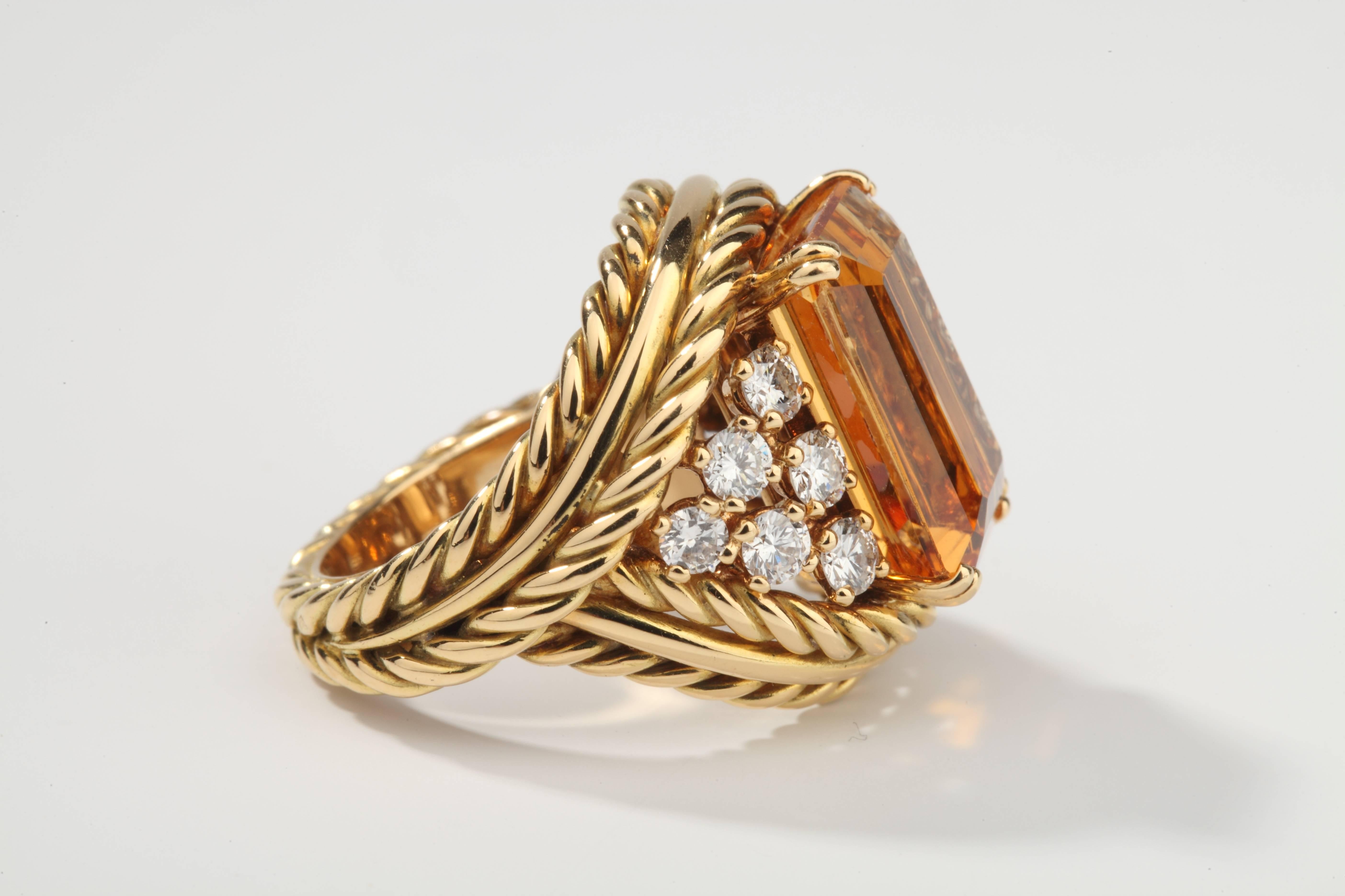 Yellow gold ring set with a rectangular cut natural Topaz, ornate with 12 brillant-cut diamonds.
The Topaz is accompanied by a GEM Lab certificate and weight around 11 ct.
Signed CHAUMET Paris.
French assay marks.
Size : US 6 / EU 52
