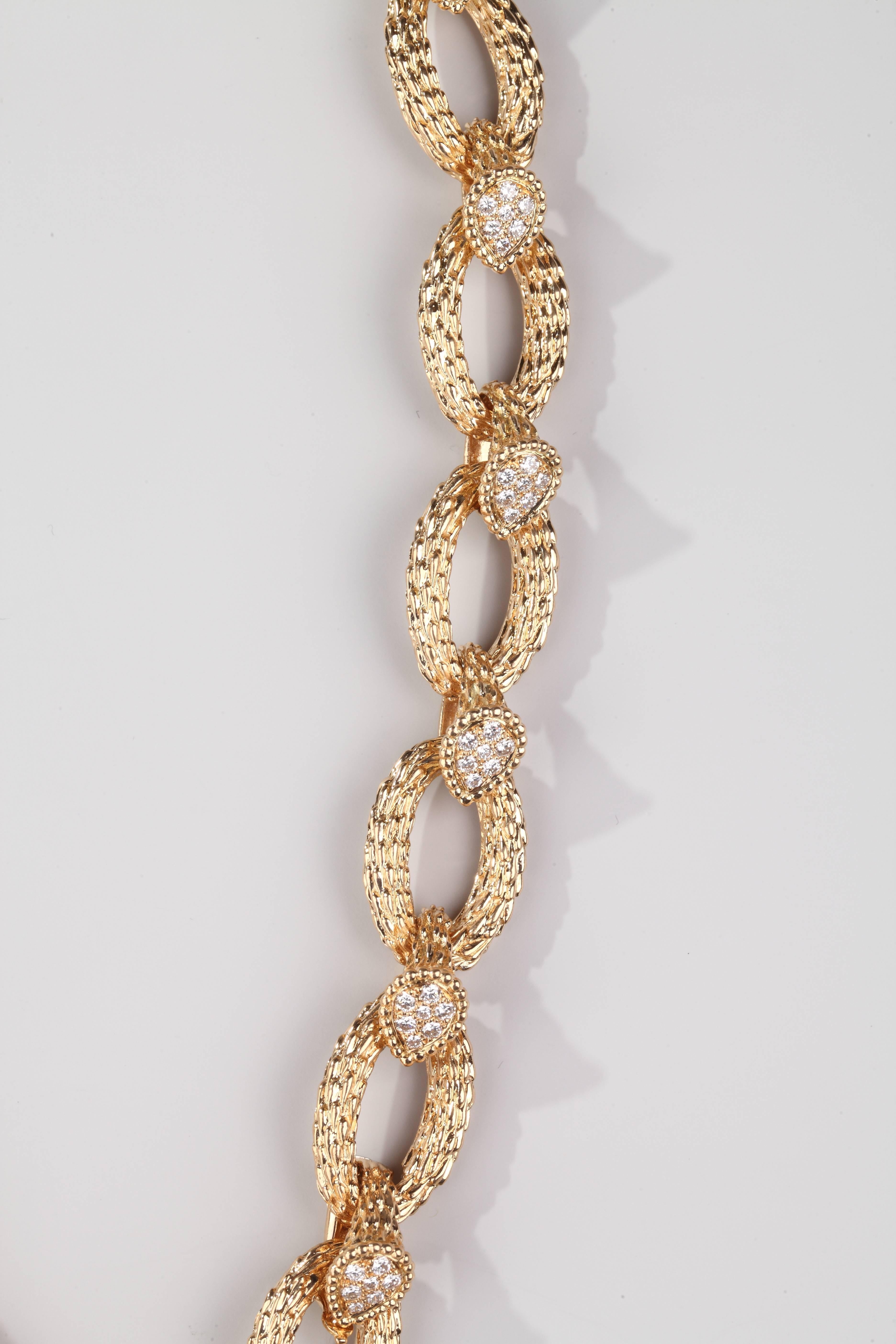 A 18k yellow gold necklace with 19 pear shape motifs set with brillant cut diamonds.

This iconic necklace was first sold in 1968 by Boucheron in reference of the snake necklace created in 1888 by Frederic Boucheron for his wife Gabrielle.
This