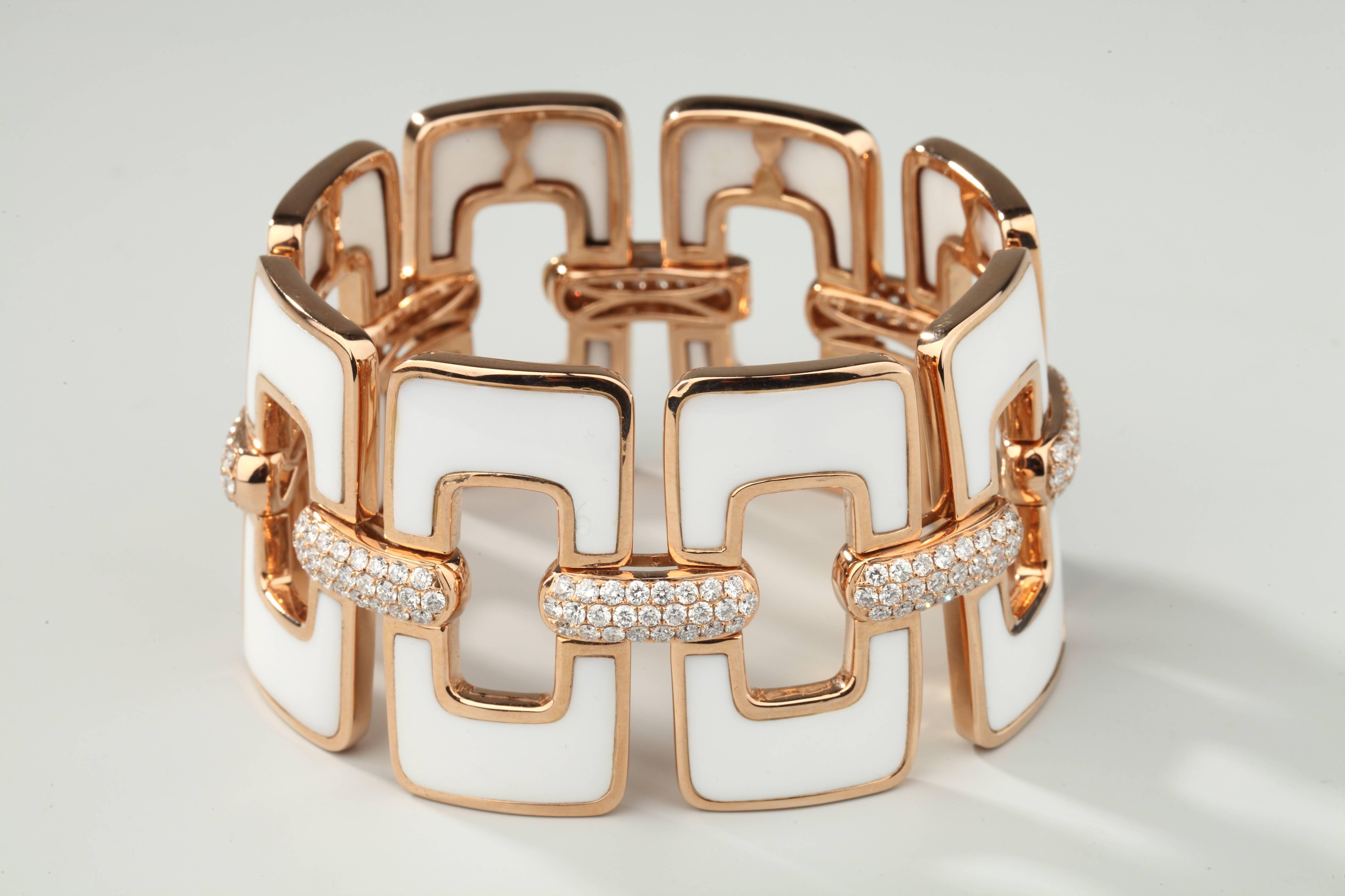 Large bracelet composed of eight rectangular motives in pink gold and white ceramic connected by pave set diamonds staples. 
Weight of diamonds : 6.78 ct.
