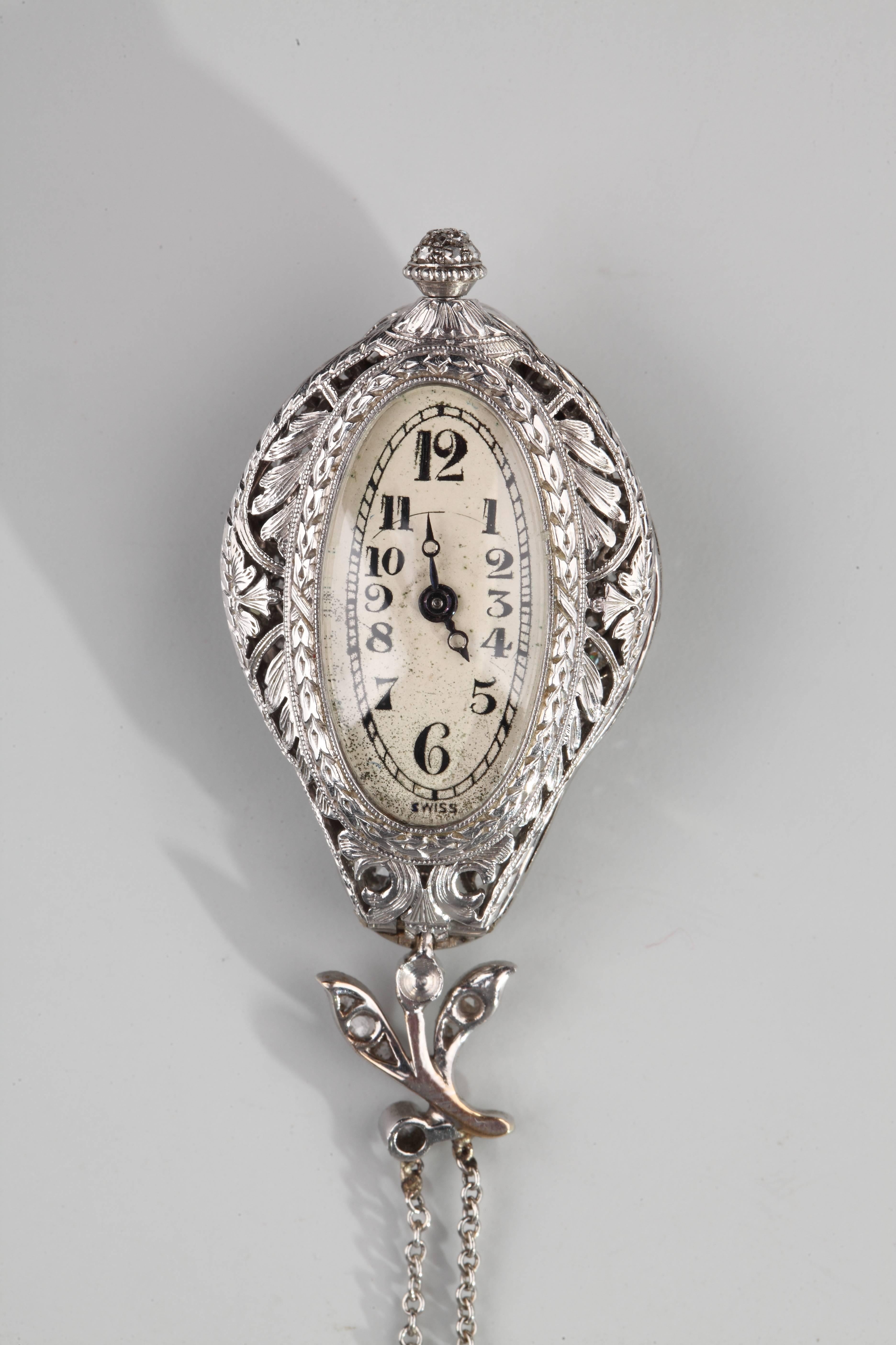 Pear-shape pendant watch in platinum and nice open-work set wit old-cut diamonds. The chain in white gold is also set with round diamonds.
Mechanical movement. (revised)
Chain : 54 cm
