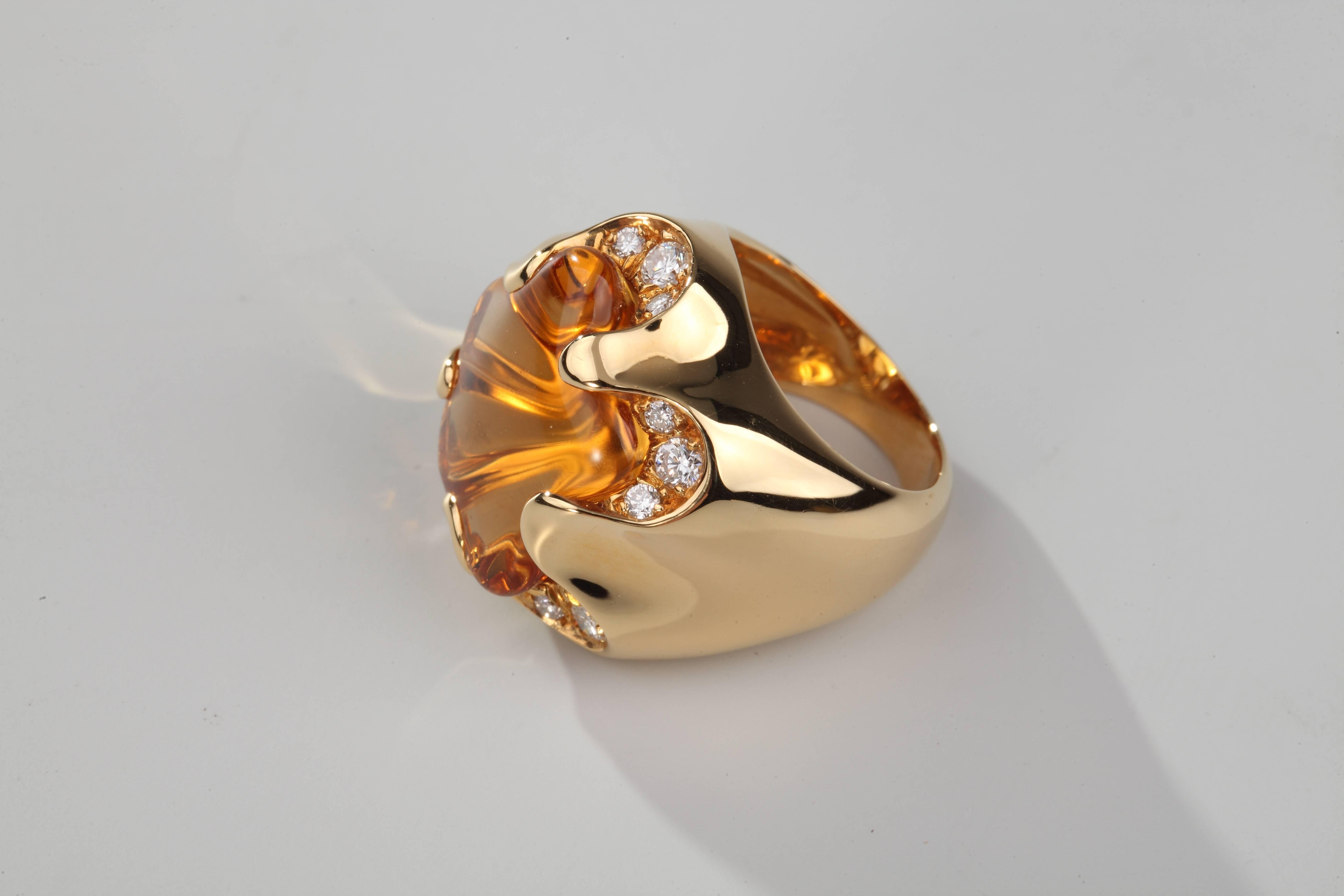 Original ring in 18k yellow gold, centered by a star-cut citrine (around 11,2 ct) set close with brillant-cut diamonds.
Signed Fred Paris and numbered.
French assay marks for gold.
Size :47 (US:4)
Can be resized.

