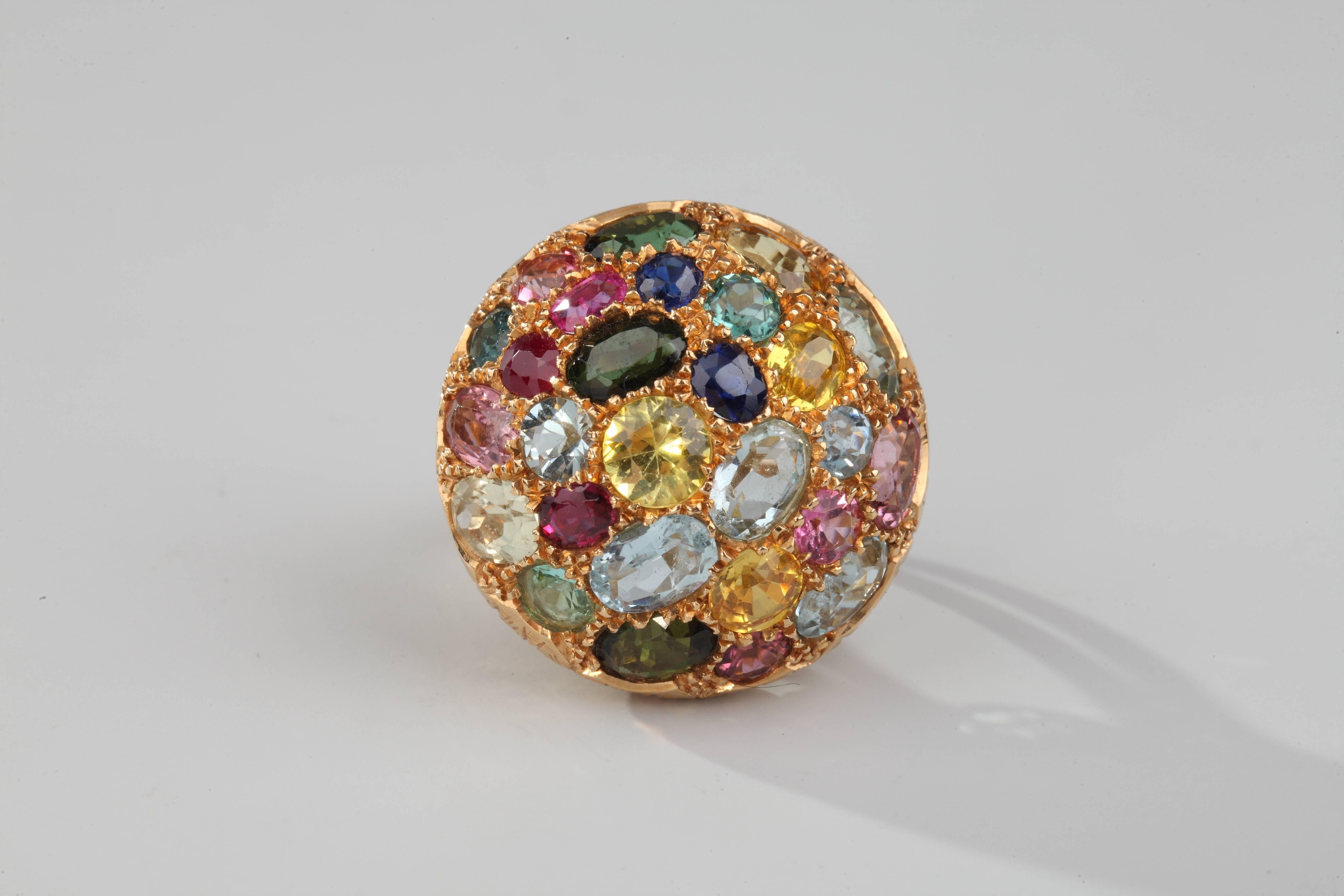 Beautiful ring in 18k yellow gold formed a a half-ball entirely paved with a gorgeous collection of fine and precious stones : blue sapphire, aqua marine, tourmaline, citrine.
Size : 51 ( US : 5.5)
