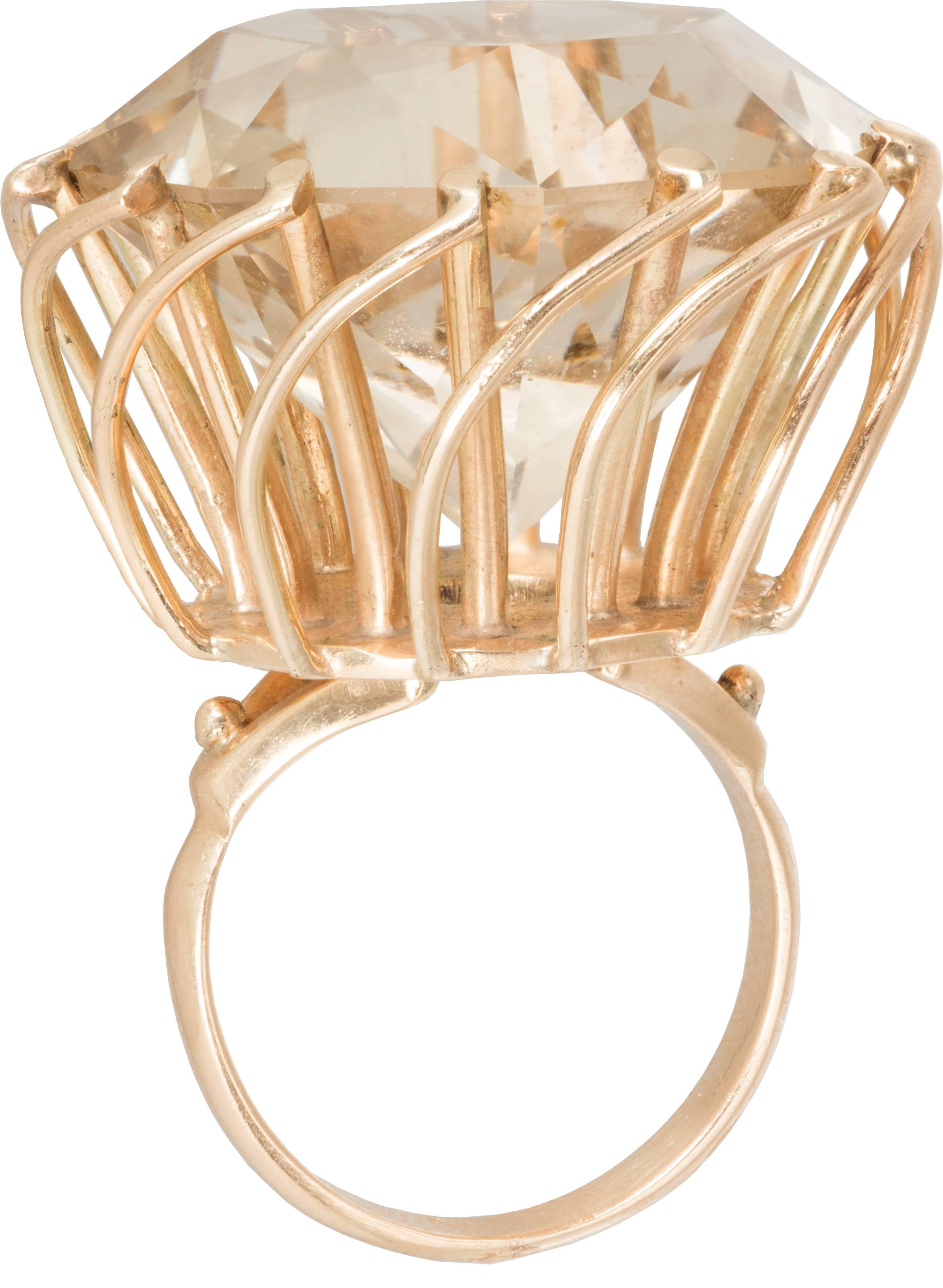 This is a statement making ring, and is so much fun with an unusual basket weave prong design surrounding the stone. The stone weighs approximately 
12 carats.

Ring is a size 7 and is sizable.
