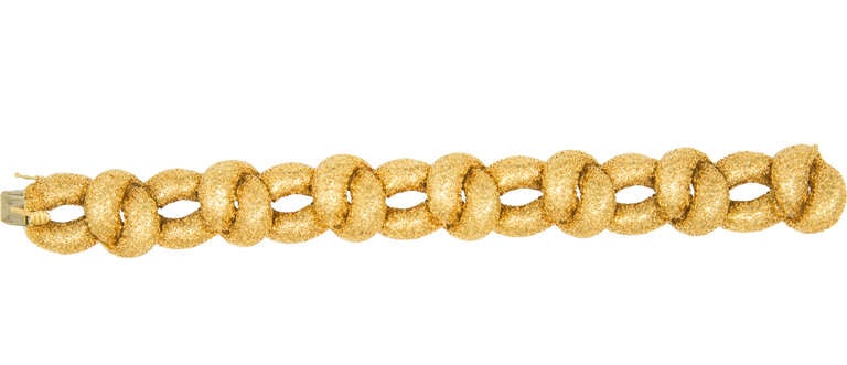 This is a tres chic, 18KT gold link bracelet. The workmanship is of the highest quality.