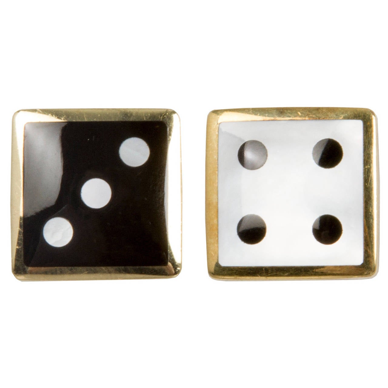 These are fun and good looking clip back earrings by Tiffany & Co. They are 18k yellow gold set with onyx and mother of pearl.