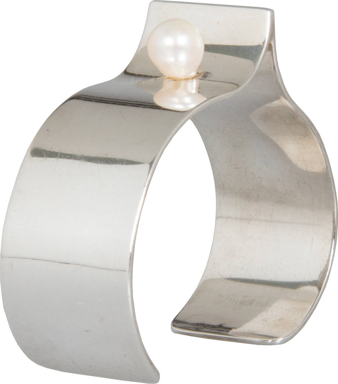 This is a great looking bracelet and easy to wear.  The interior circumference of the cuff is 6.25 inches. It was made by Bill and Patsy Roach, son and daughter inlaw of modernist jeweler Ruth Roach.