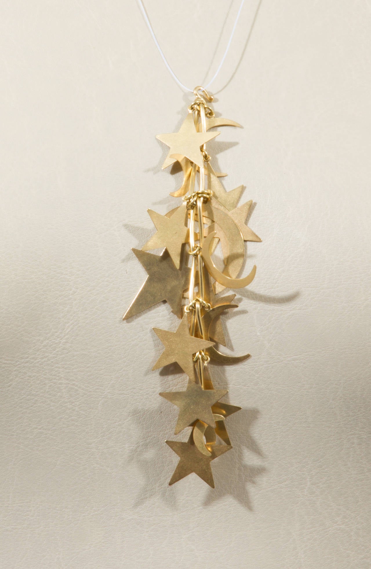 Gold Stars and moons Mechanical Moveable Pendant In Excellent Condition For Sale In Chicago, IL