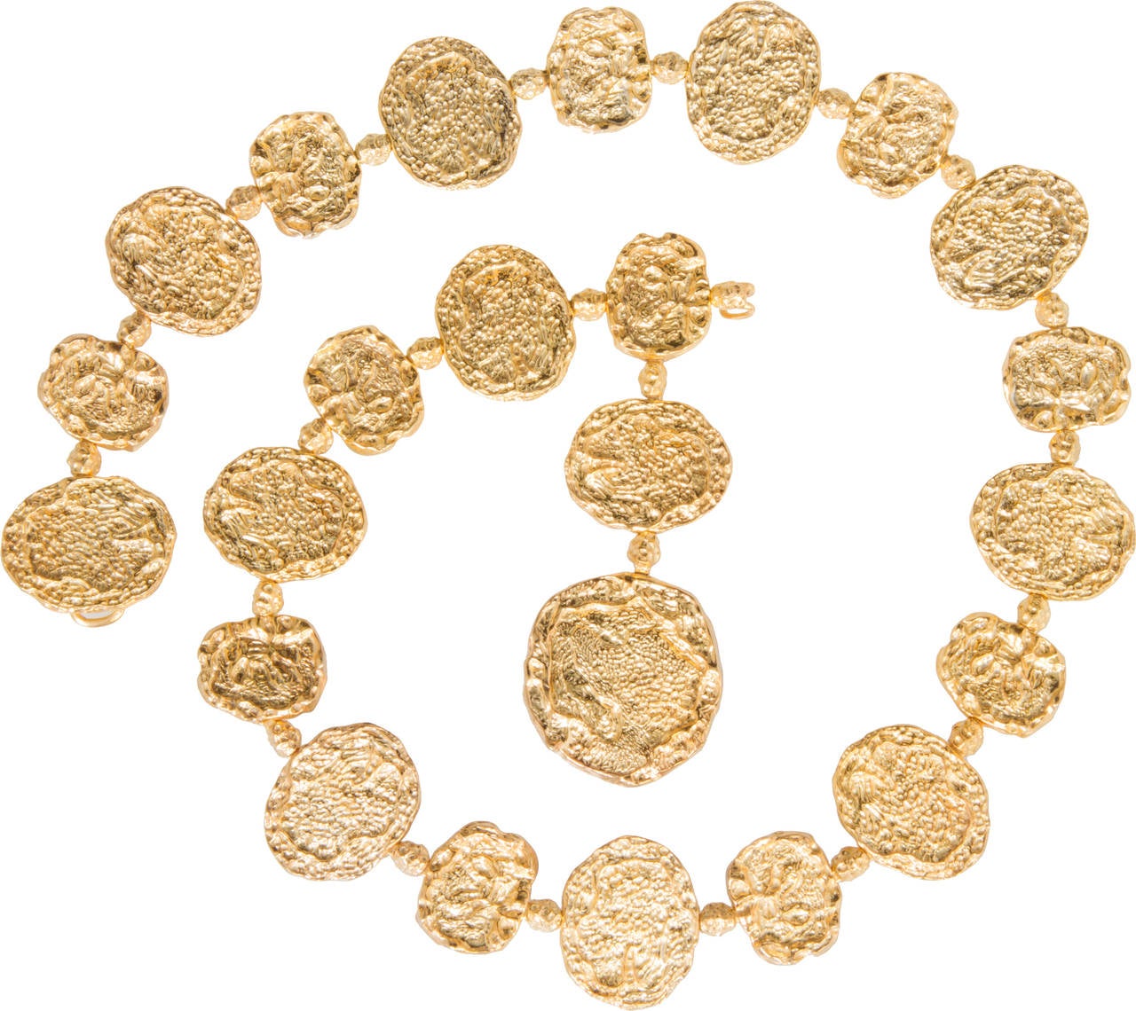 Each element of this Cartier belt is richly textured and has a wonderful gold vermeil finish. This piece can be worn as a belt or necklace. Made for a maximum 33