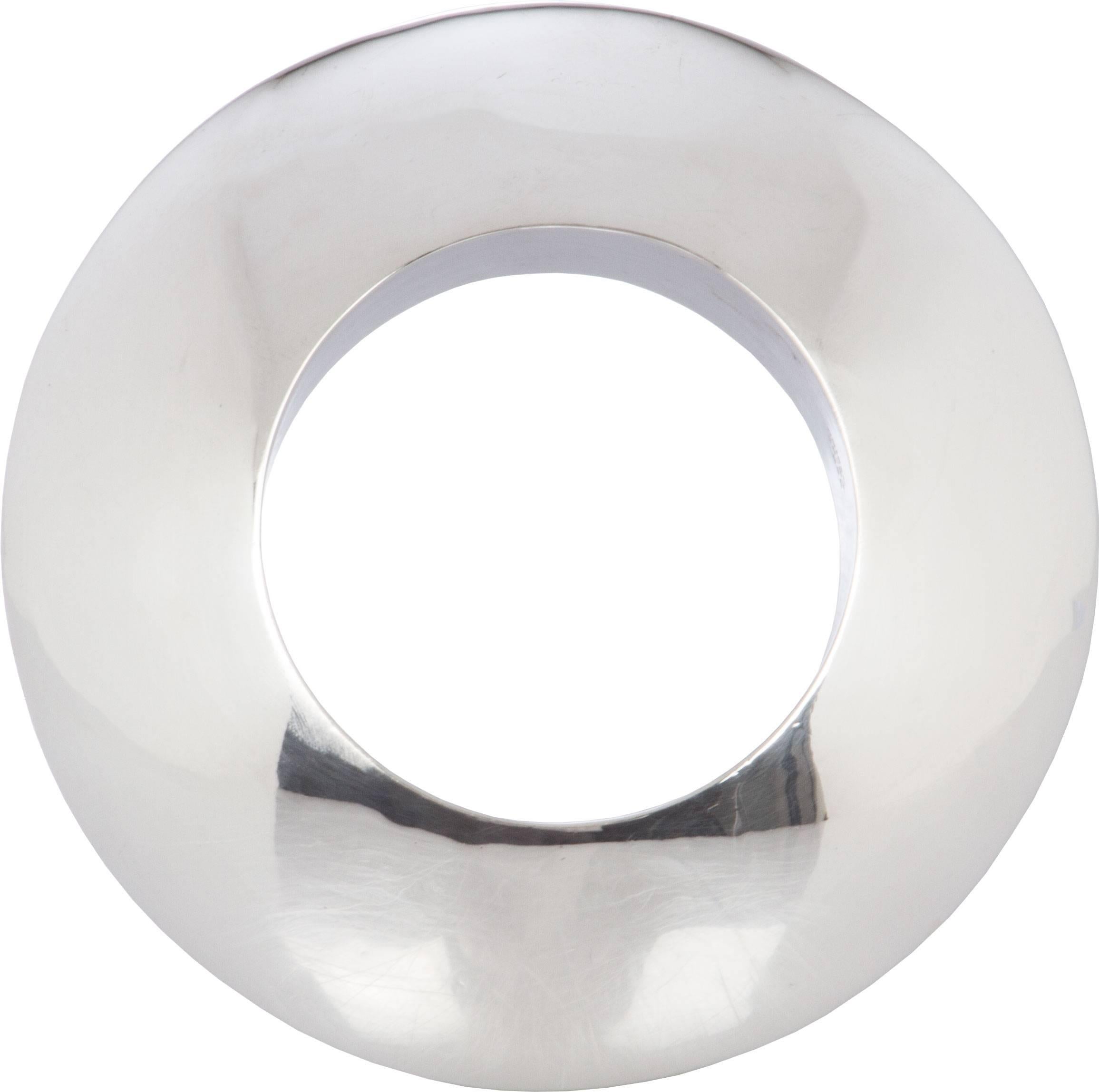 This is a fabulous sculptural, statement making piece. The bangle measures 8 inches in diameter, with an interior diameter of 5 inches.  The height is 1 1/2 inches