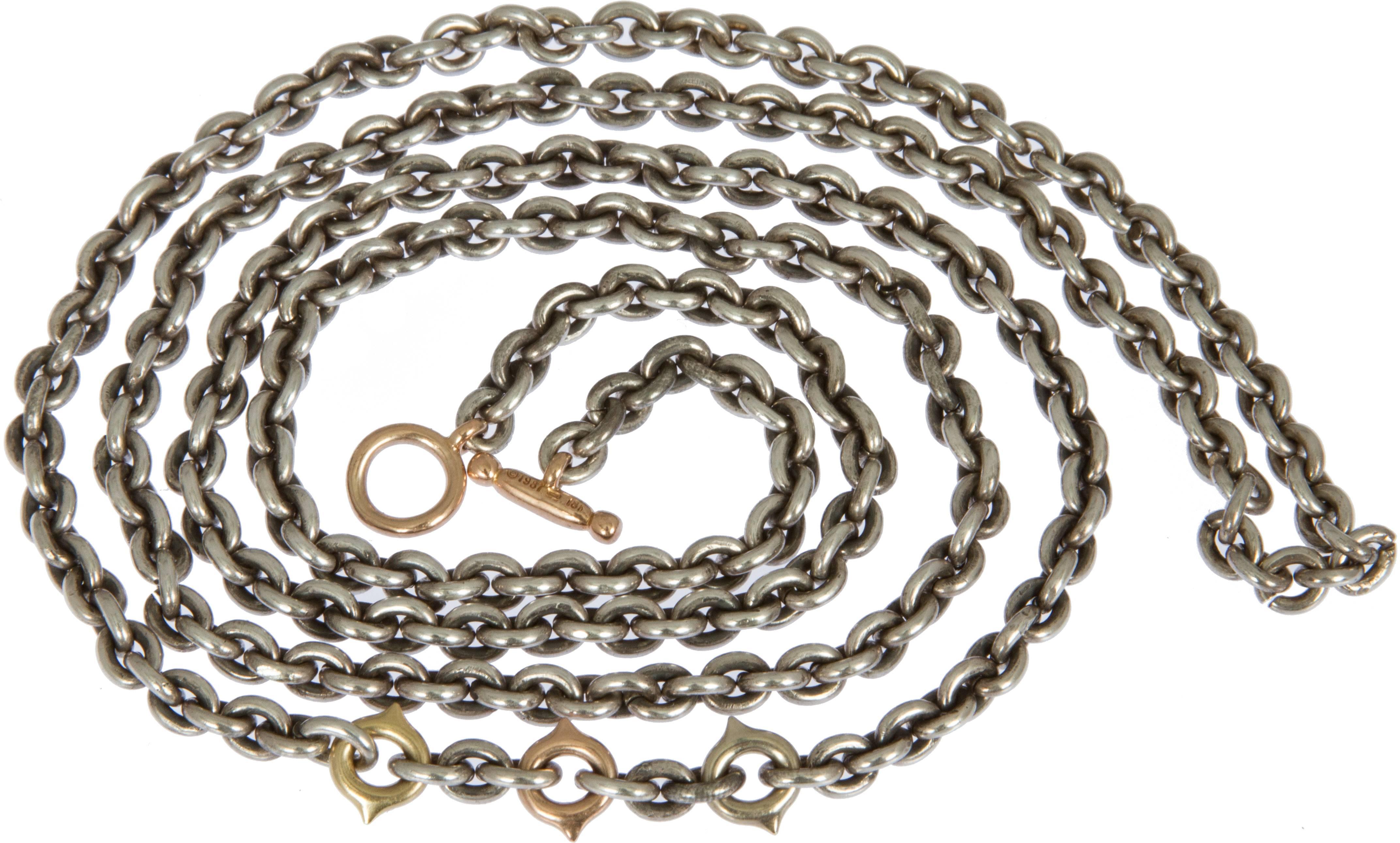 This interesting and versatile chain necklace that can be worn many ways. It has 18 karat gold elements interspersed.