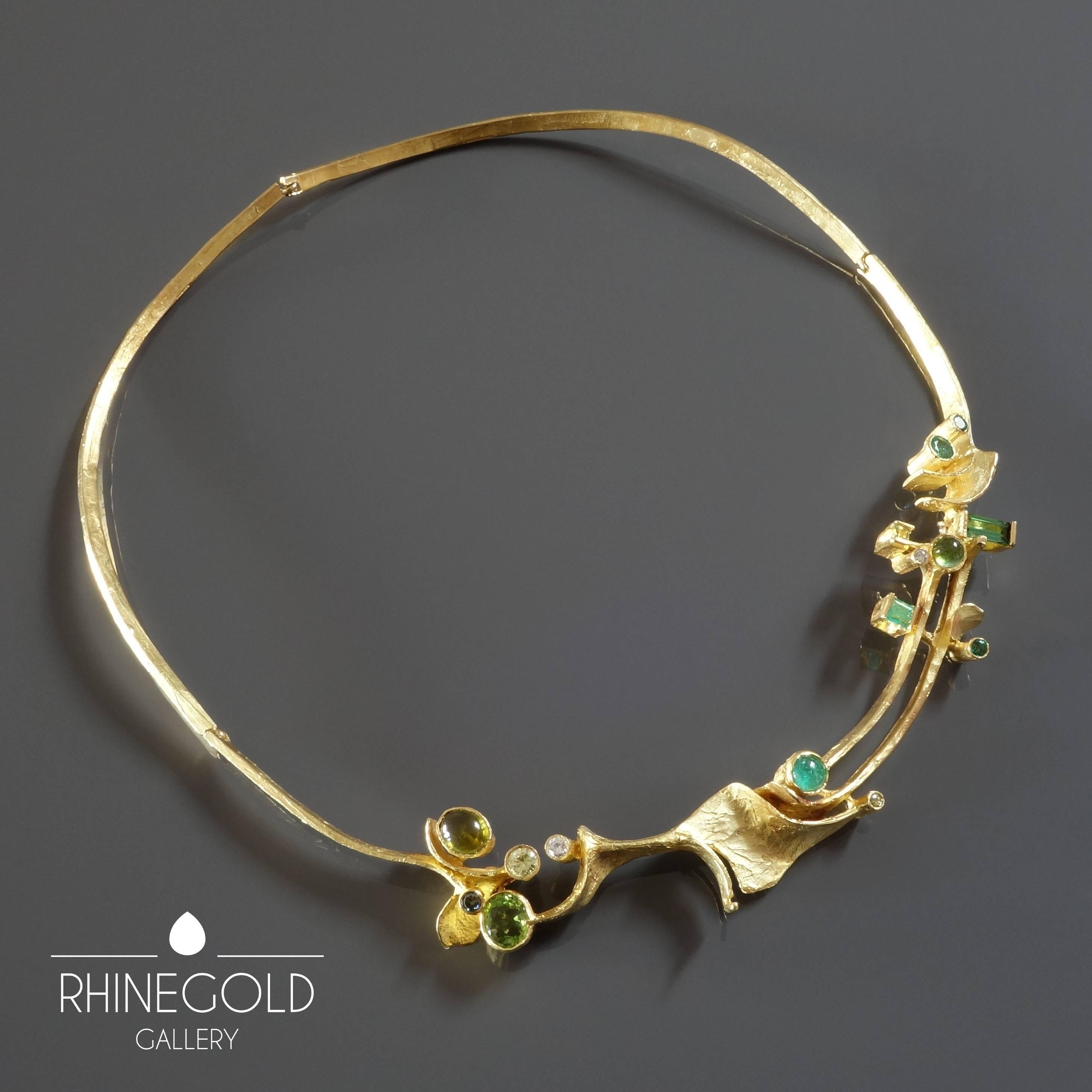 Klaus Neubauer: Modernist Green Gemstones Gold Necklace 
18k yellow gold, 5 brilliant cut diamonds (1 dark green (si) 0.05ct; 2 light green (si) 0.25ct + 0.04ct; 2 white (vs) 0.1ct + 0.03ct = 0.47ct in total), 1 cabochon cut, 3 brilliant cut, 1