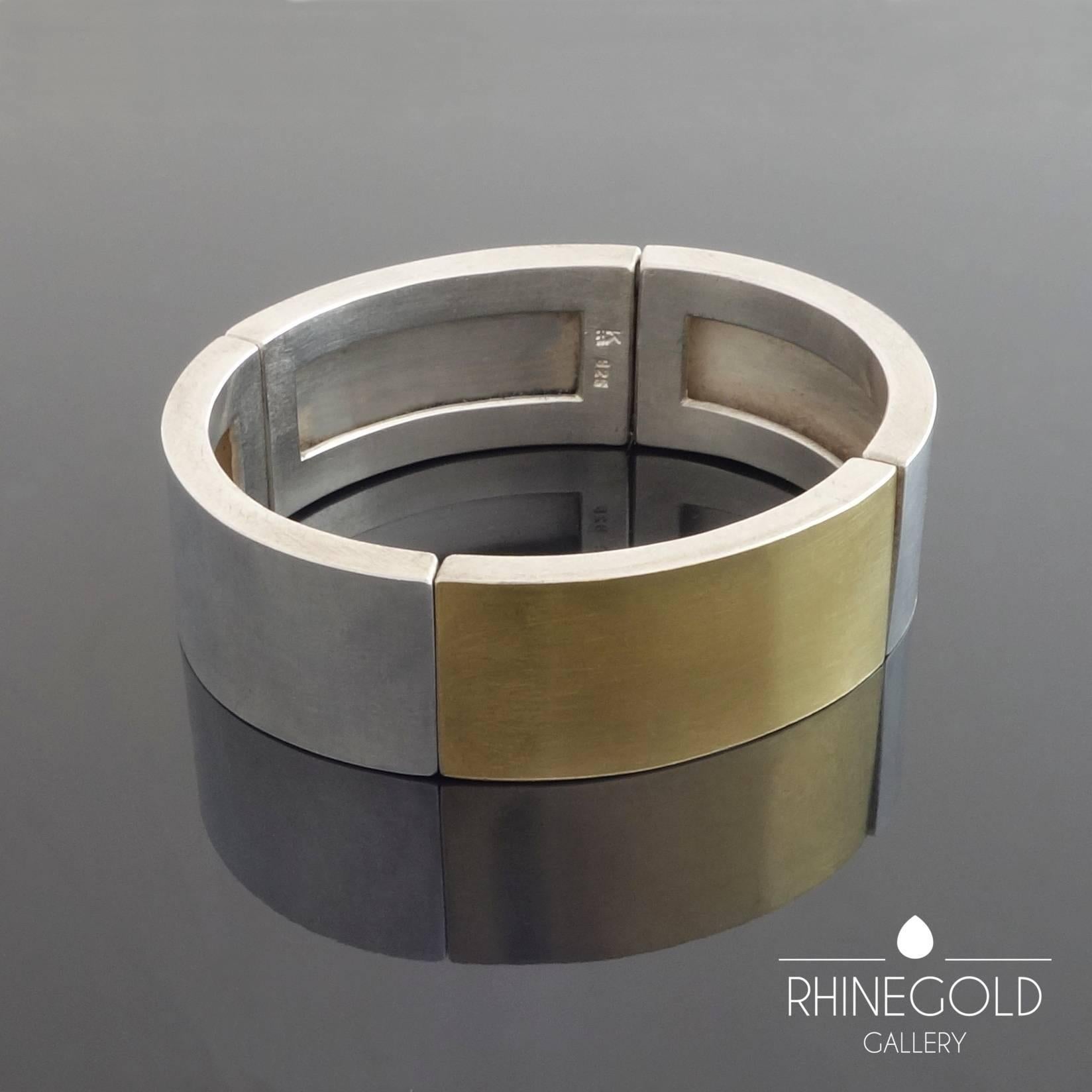 Monika Killinger (1941 -):  Modern Flexible Gold Silver Bangle
Sterling silver, fine gold (0.999), rubber band
Width 1.85 cm (approx. 3/4"); internal dimensions 5.8 cm to 5.1 cm (approx. 2 5/16" to 2")
Weight approx. 50.5