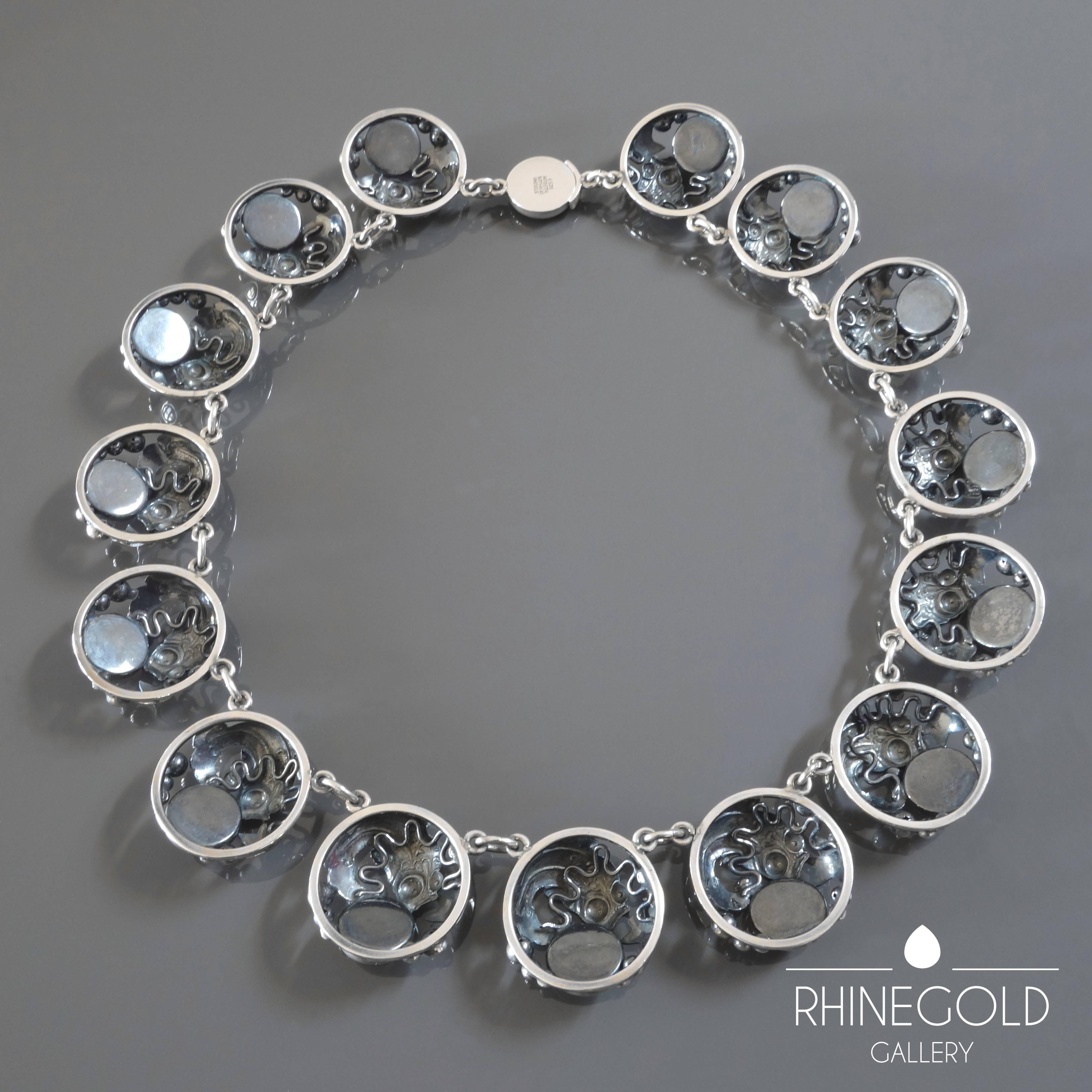 Niels Erik From: Modernist Aquatic Amber Silver Necklace
Silver 925, amber
Length 40.5 cm (approx. 15 3/4"), width 2.4 cm (approx. 1")
Weight 77.6 grams
Marks: ‘STERLING  DENMARK  N.E.FROM  925S’
Denmark, 1960s – 1970s

Jumping