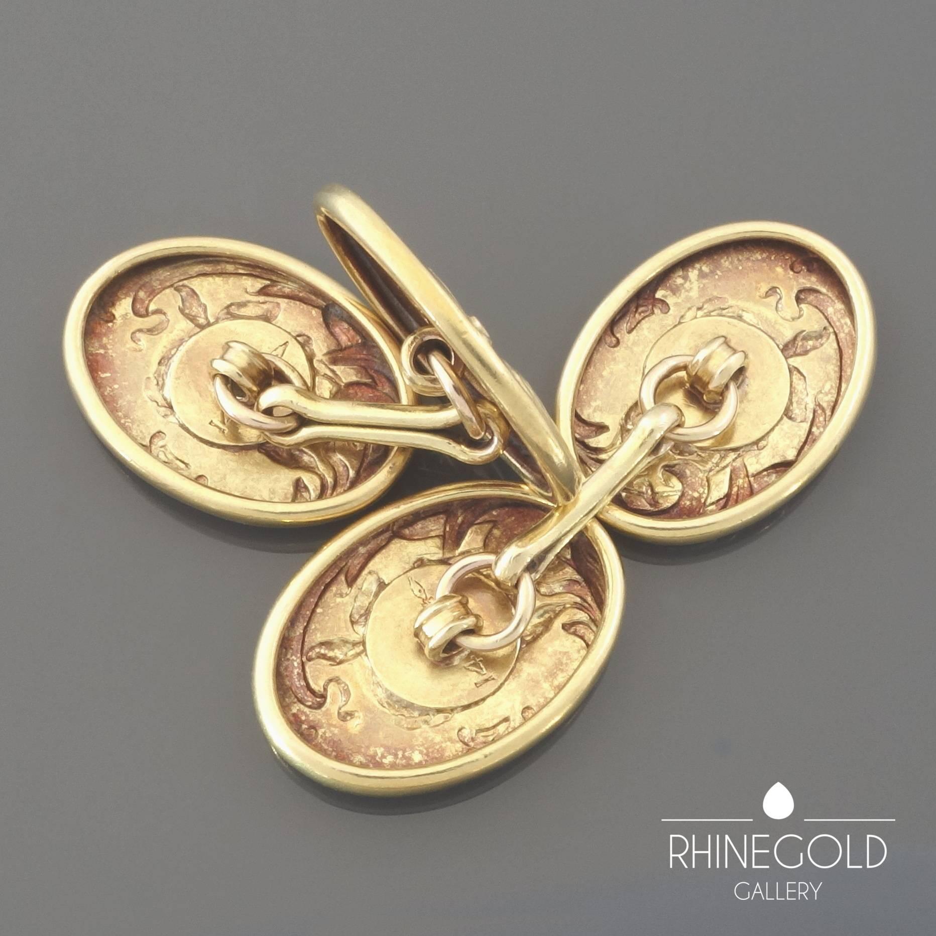A Pair of Art Nouveau Iris Flower Repoussé Gold Double Cufflinks
14k yellow gold
Fronts 1.9 cm to 1.4 cm (approx. 3/4” to 9/16”)
Marks: ‘14’ for 14k gold plus illegible mark
ca. 1900

A repoussé iris flower in fine detail emerges from the stylized