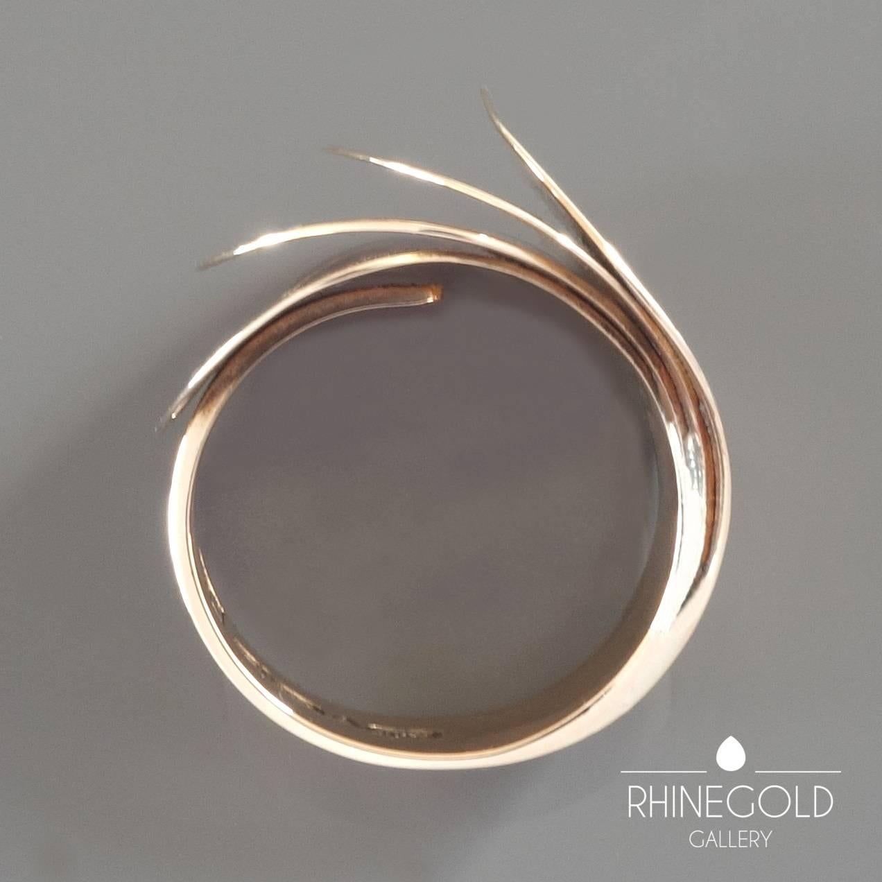 1970s Urpo Kajander for Kaunis Koru Finnish Modernist Gold Ring
14k rose gold 
Ring head 2.1 cm wide (approx. 13/16”) 
Ring size: adjustable, current size: Ø 18.1 mm = EU 57 / US 8 / ASIA 16
Weight: 13.4 grams
Marks: ‘UJK’, [Finnish national mark],