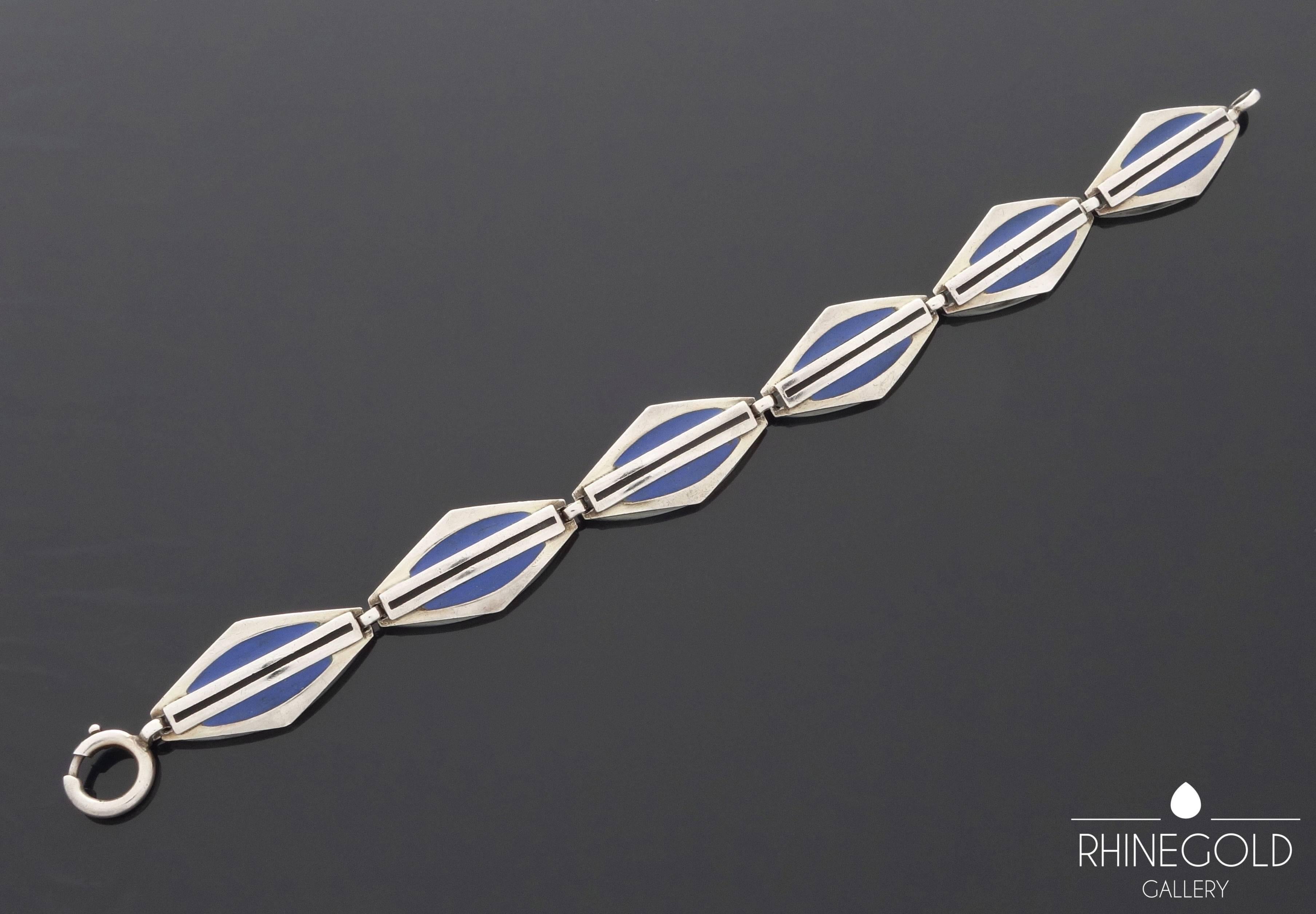 1920s Theodor Fahrner Art Deco Matte Enamel Silver Bracelet
Silver 935, matte enamel in lagoon blue and black
Lenght 18.5 cm (approx. 7 1/4"), width 1.5 cm (approx. 5/8")
Marks: ligated “TF” in a circle; "935"
Germany, ca. 1925