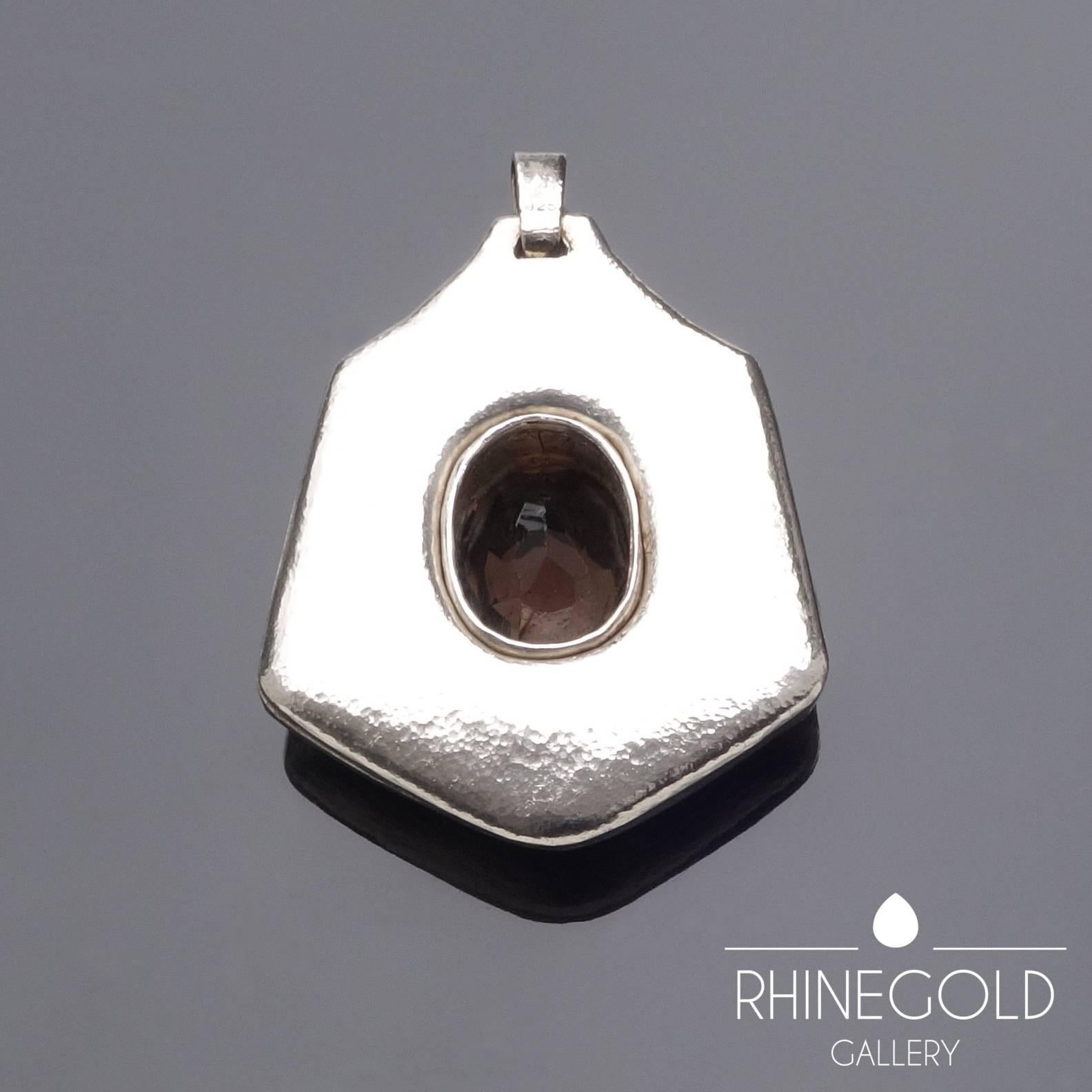 Rudolf Steiner Anthroposophical Smokey Quartz Sterling Silver Pendant 
Sterling silver, smokey quartz
Height (with bail) 5.8 cm (approx 2 1/4"), width 4.0 cm (approx. 1 9/16")
Marks: Sterling silver content mark ‘925’, maker’s mark