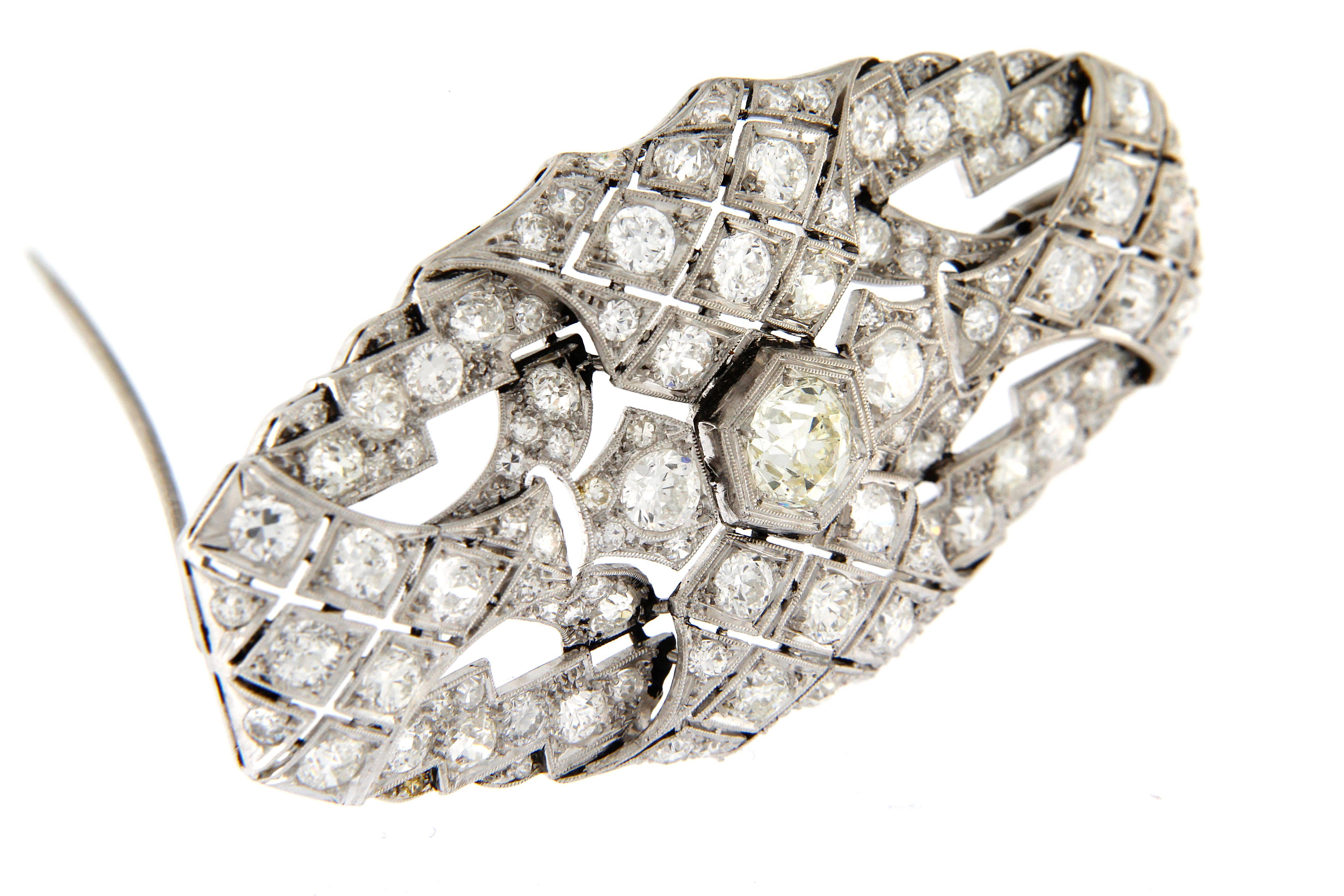 Art Deco' brooche made in platinum excellent conditions, set with mine cut diamonds 
central diamaond ct. 1.00 circa
all other diamond total weight circa 6.50 ct