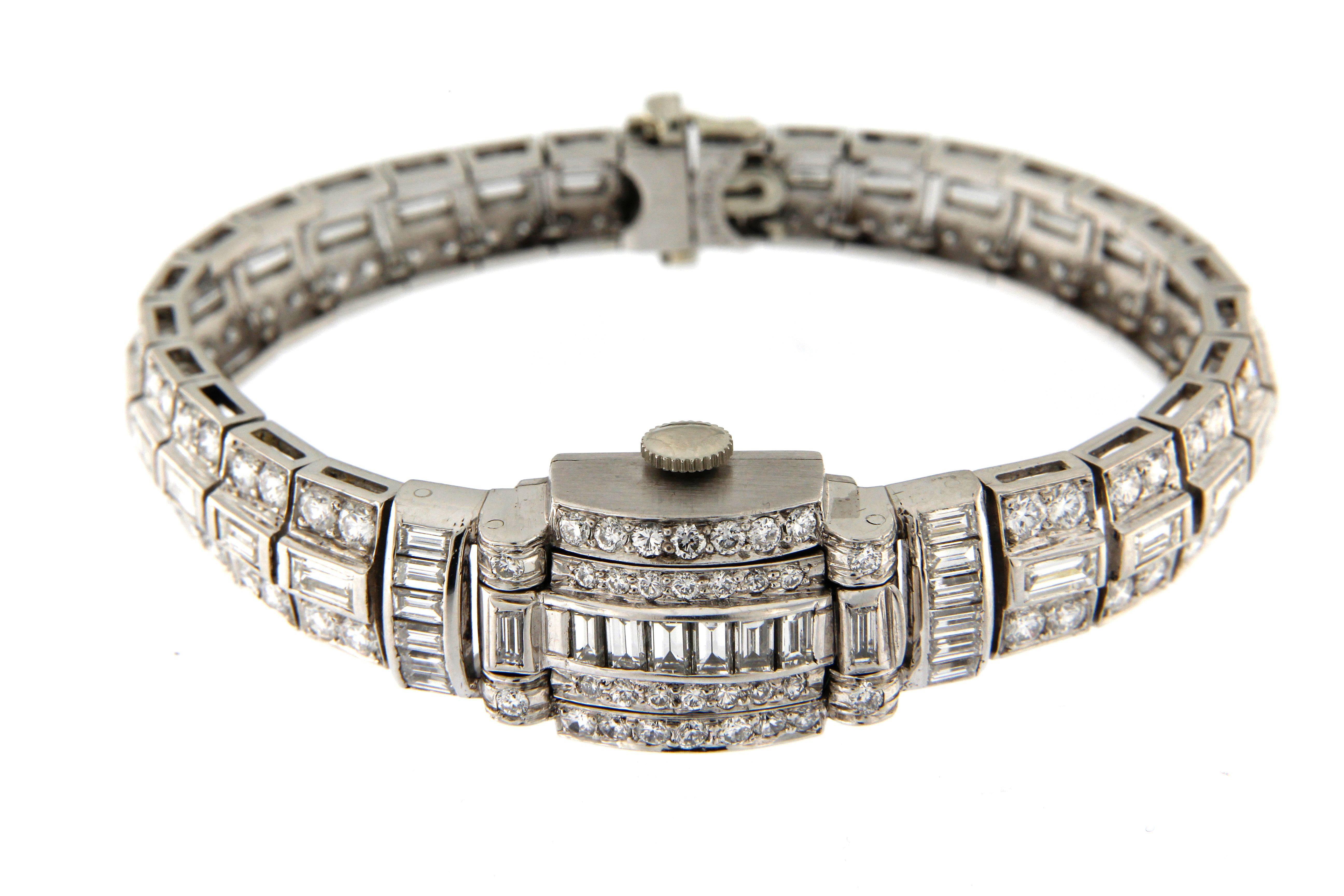 Branded Hamilton, made in Swiss, 1960 circa. This kind of jewel was generally produced in Italy and then set with the watch in Swiss. Very rich diamond bracelet set with baguette circa ct. 4,00 and full round cut diamonds circa ct. 4.00, a spring