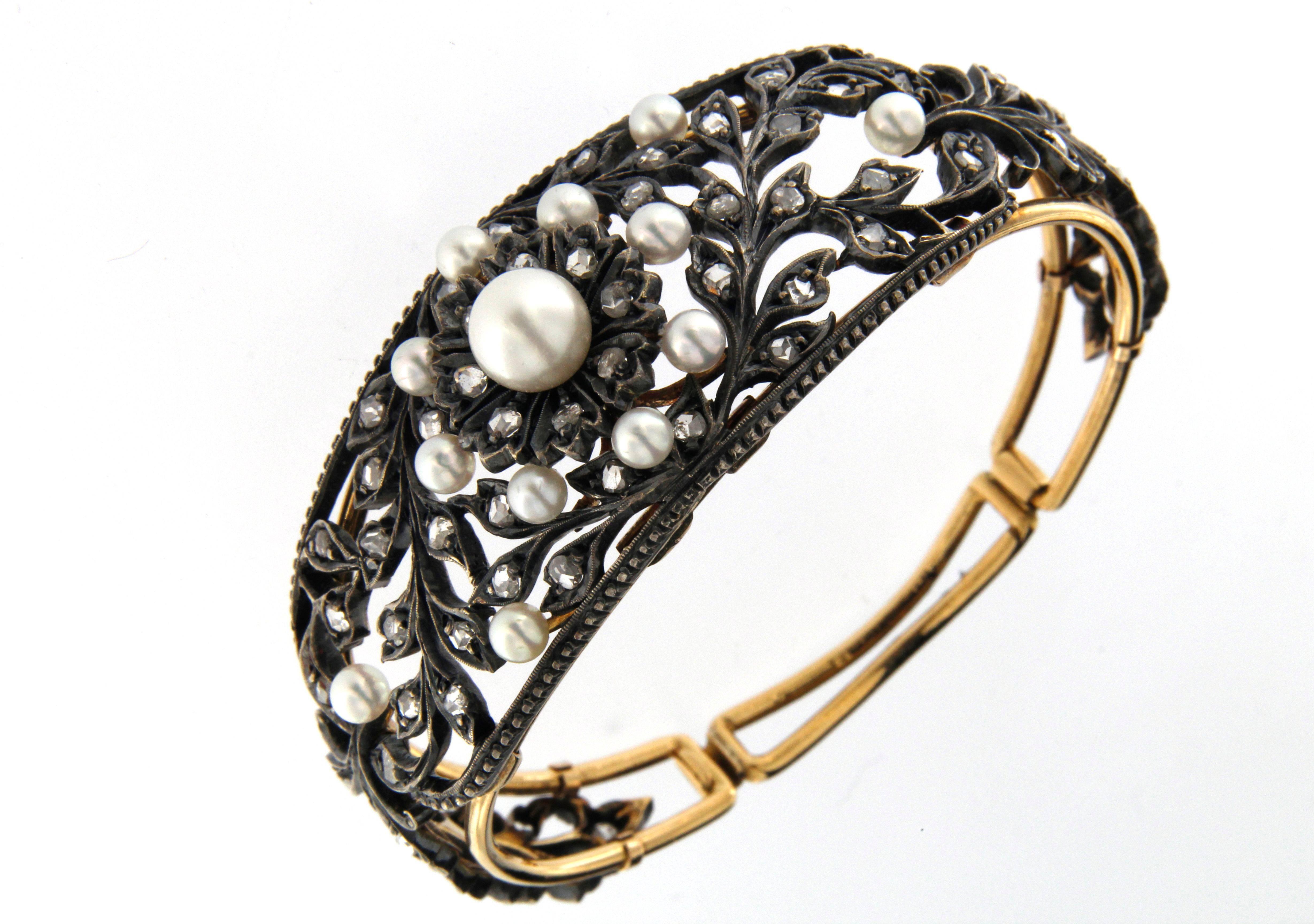 very nice construction for this bangle, inside structure in 18 kt gold, outside silver (the black color is given by the oxydation ), set with rose cut diamonds ( cts. 1,00 ) and cultured pearls. very good conditions