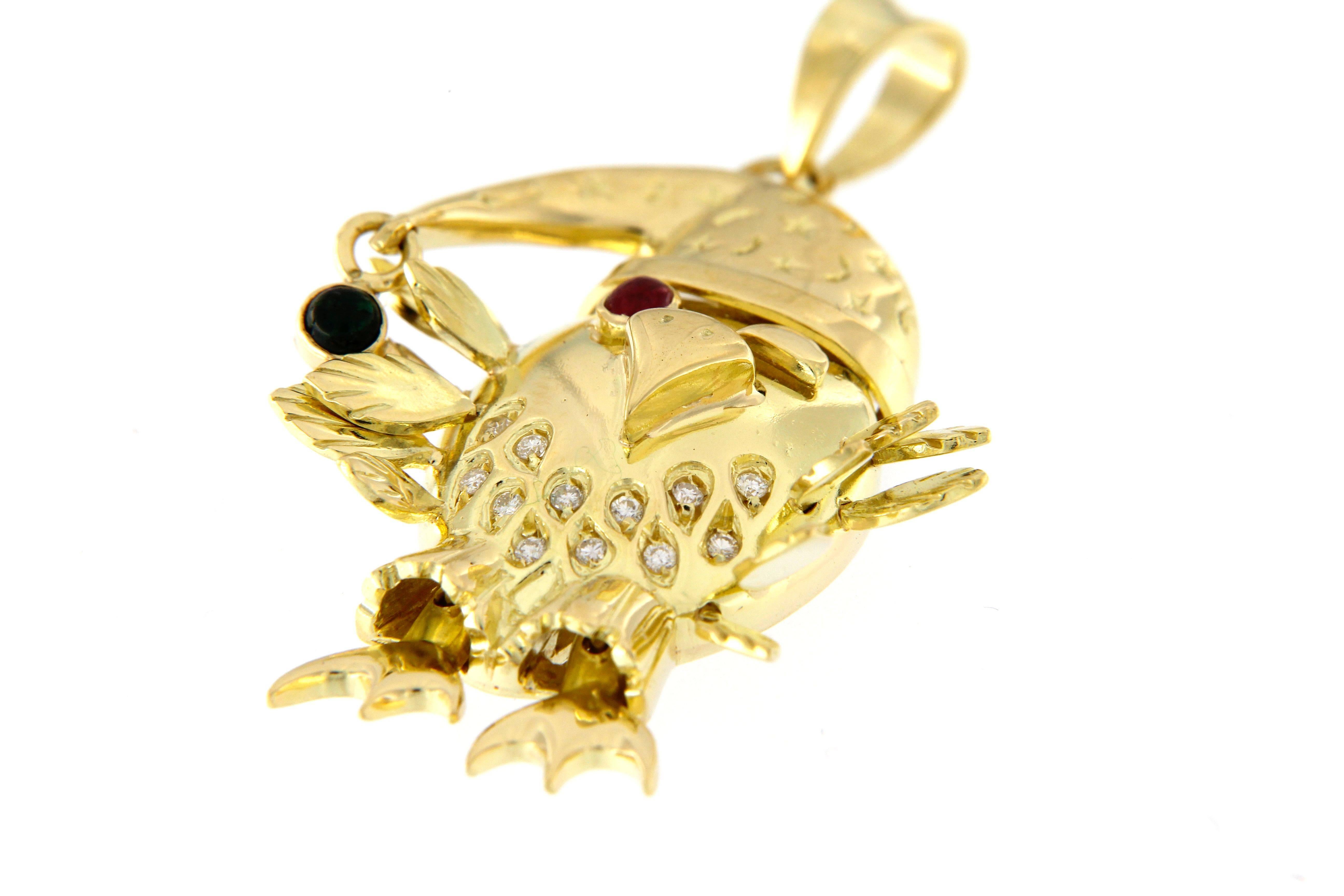 Happy Owl pendant, entirely handmade, 18 kt gold set with full cut dimonds ct. 0.10 + ruby and sapphire
will be delivered with a certificate of garanty