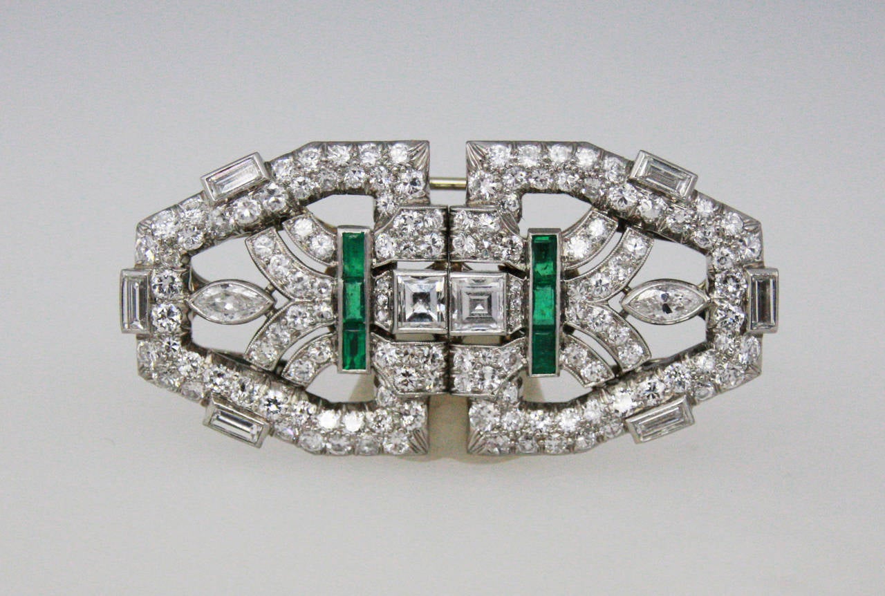 Art Deco double clip brooch set with square, marquise, straight baguette and round diamonds weighing approximately 8 carats.