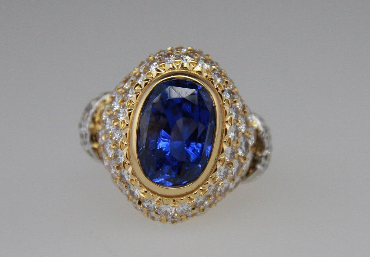 Ring is set with an oval sapphire weighing 7.64 carats, and round diamonds weighing 2.20 carats.
The ring is a size 6 and can be sized.