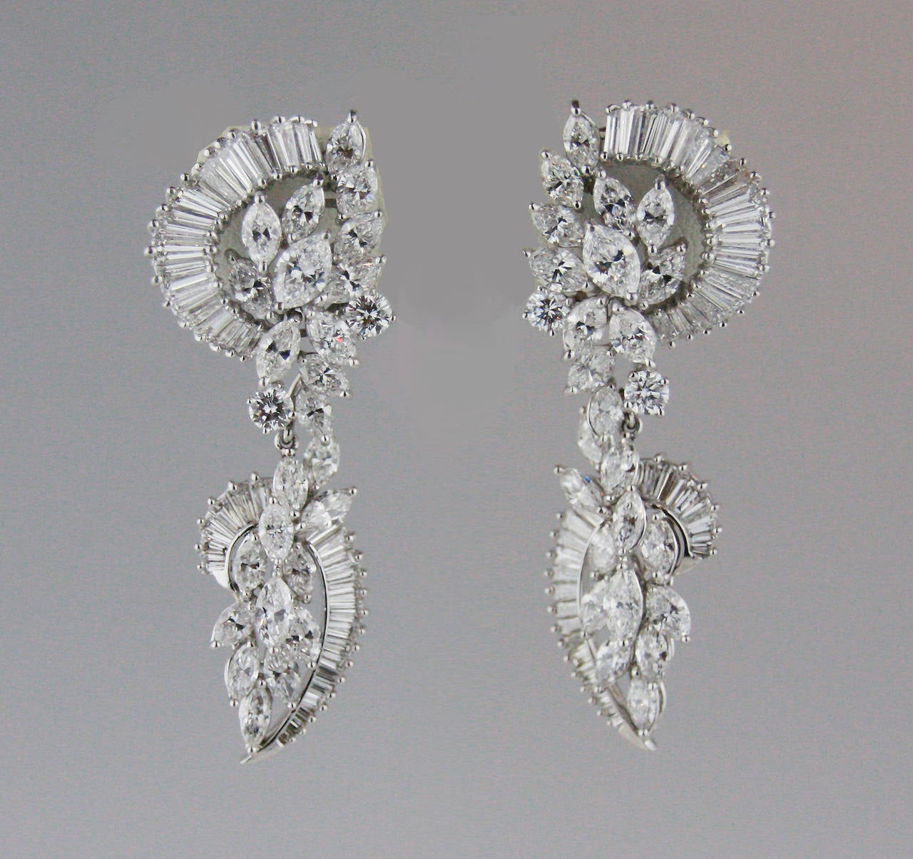 1960s Diamond earrings set with approximately 19 carats of marquise, round and baguette shaped diamonds. The diamonds are G/H in color and mostly VS in clarity. The bottoms are removable.