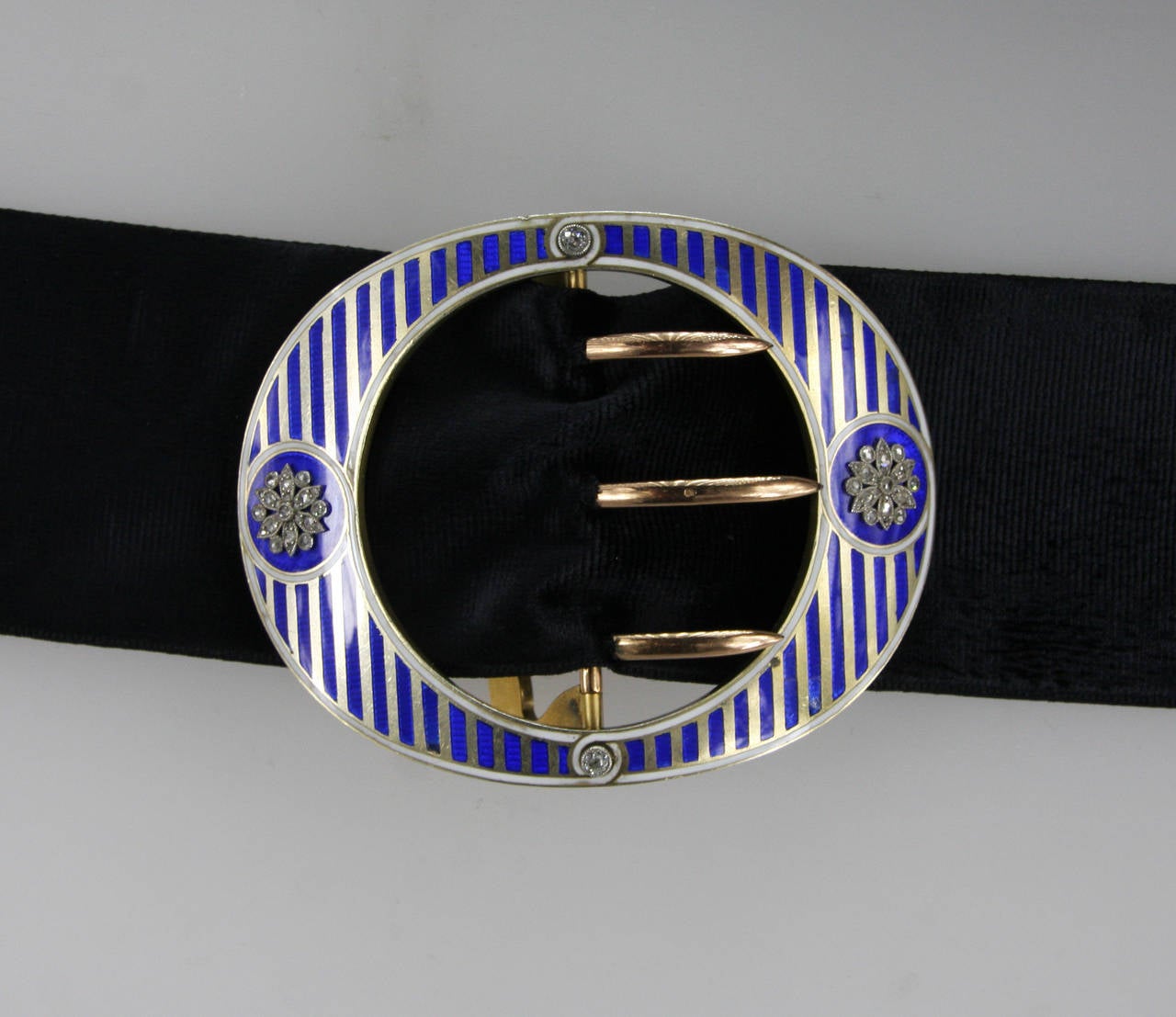 Rare 1900's Cartier belt buckle with flower motifs set with old mine cut diamonds. Signed 'Cartier Paris', numbered, with maker's mark and eagle stamp.