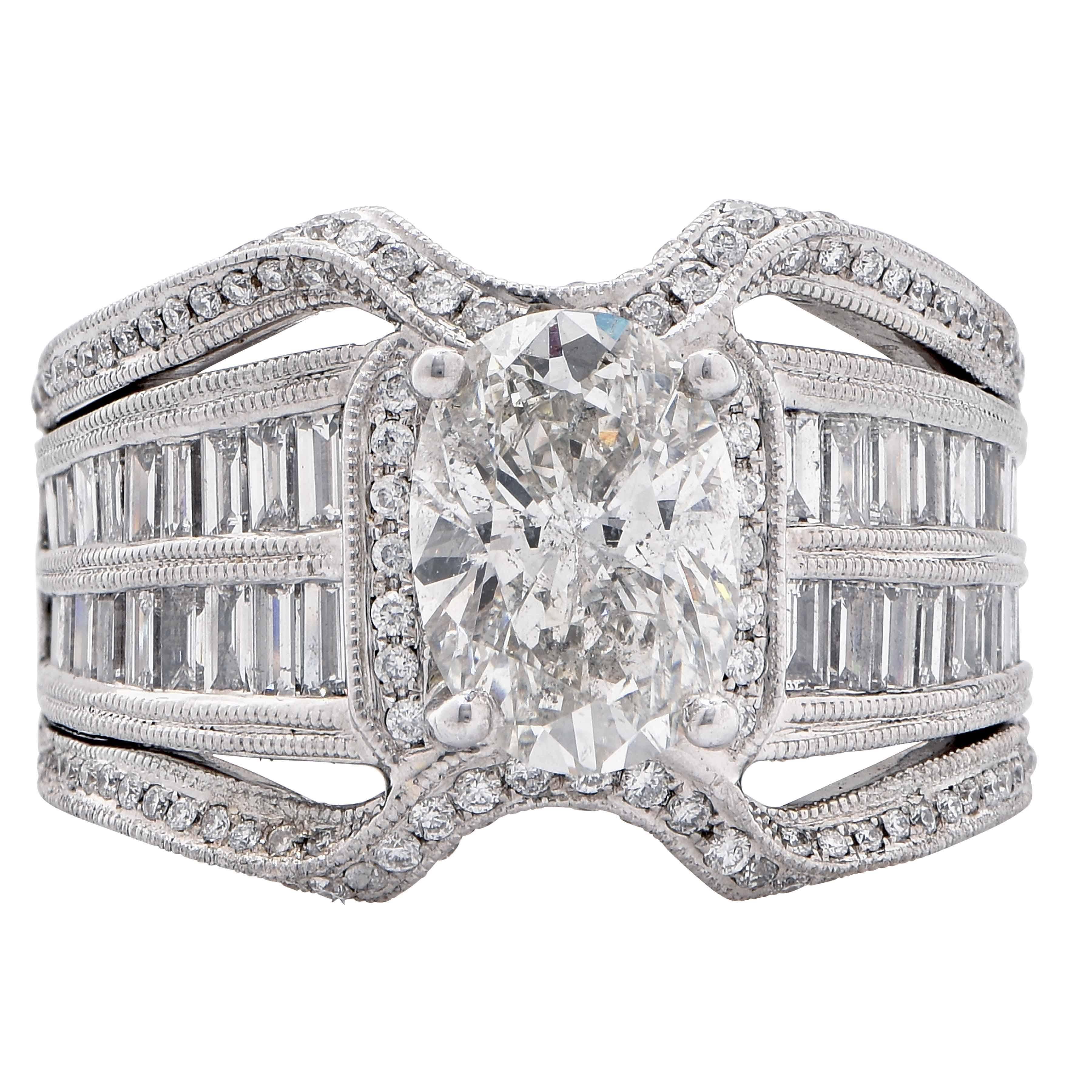 This lively 18 Karat White Gold Cocktail ring features 1.3 Carats of mix cut diamonds and a center 2.03 Carat Oval Cut Diamond GIA Graded J/ I1.
Ring Size 6 (can be sized)

Metal Type: 18 Kt White Gold
Metal Weight: 11.5 Grams