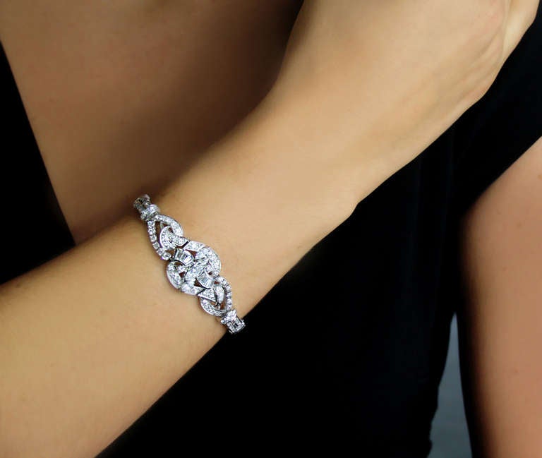 Flexible platinum bracelet set with single cut and full cut diamonds. The total diamond weight is approximately 5cts.