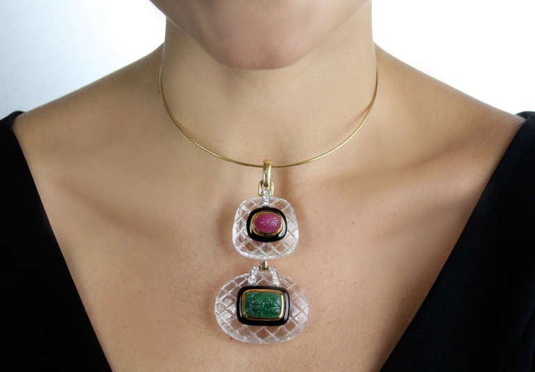 Rare David Webb rock crystal pendant necklace set with carved ruby, carved emerald, round diamonds and black enamel.