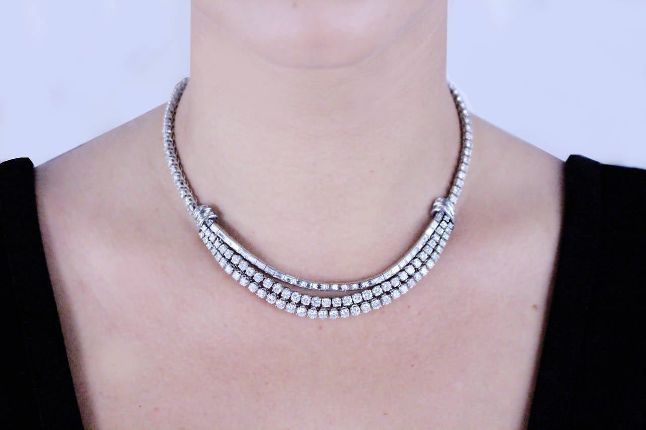 Diamond necklace set with round and baguette diamonds in platinum. 
Diamonds are mainly G/H in color and VS in clarity. 
Approximately 16 carats of diamonds. 
Length of necklace is 16 inches. 