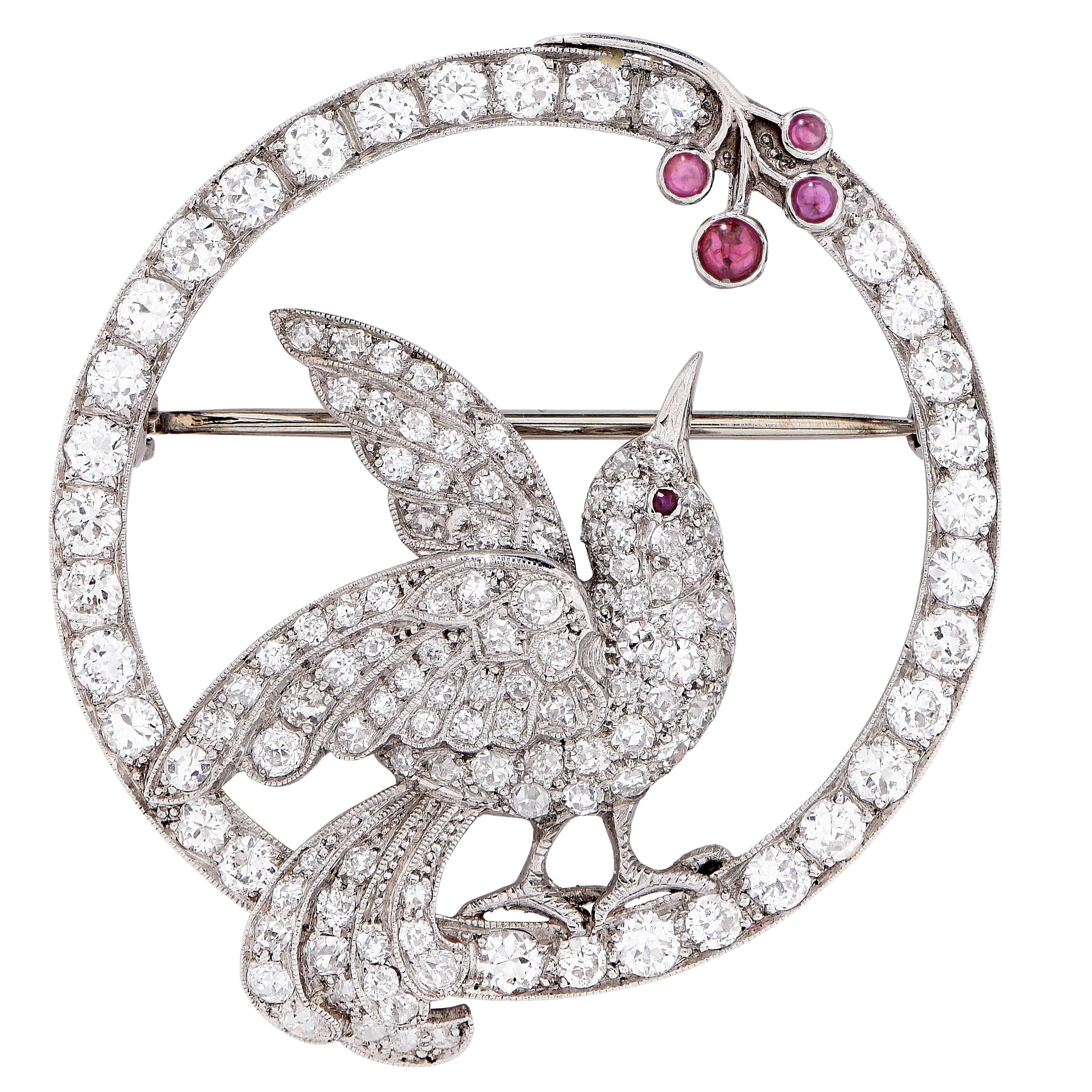 This gorgeous platinum brooch depicts a whimsical motif of a bird picking berries. The brooch is set with 126 Old European cut, and single cut diamonds weighing approximately 3.50 carats, and 5 cabochon rubies.

Metal Type: Platinum
Metal Weight: