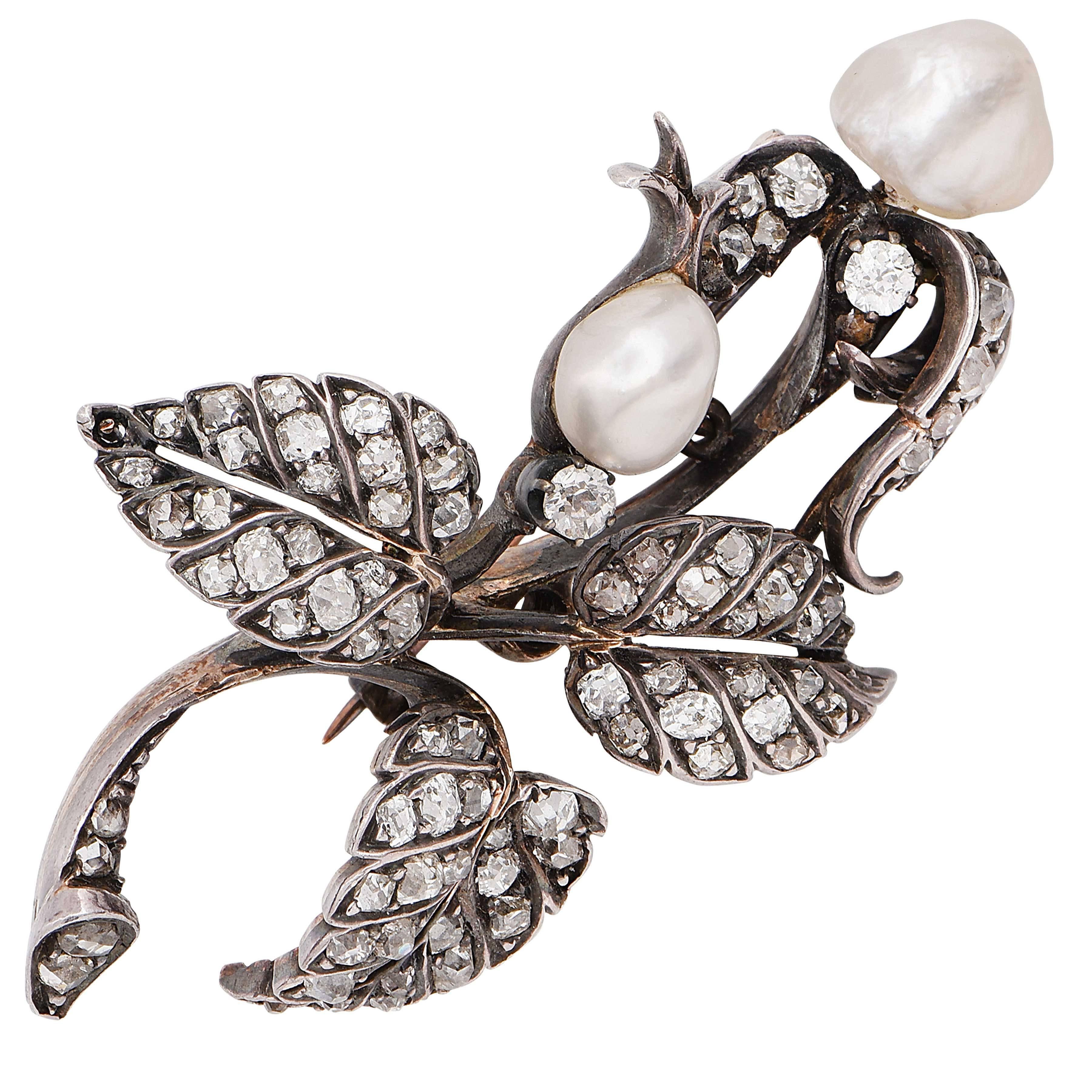 Natural pearl and old mine cut diamond brooch set in silver topped gold.