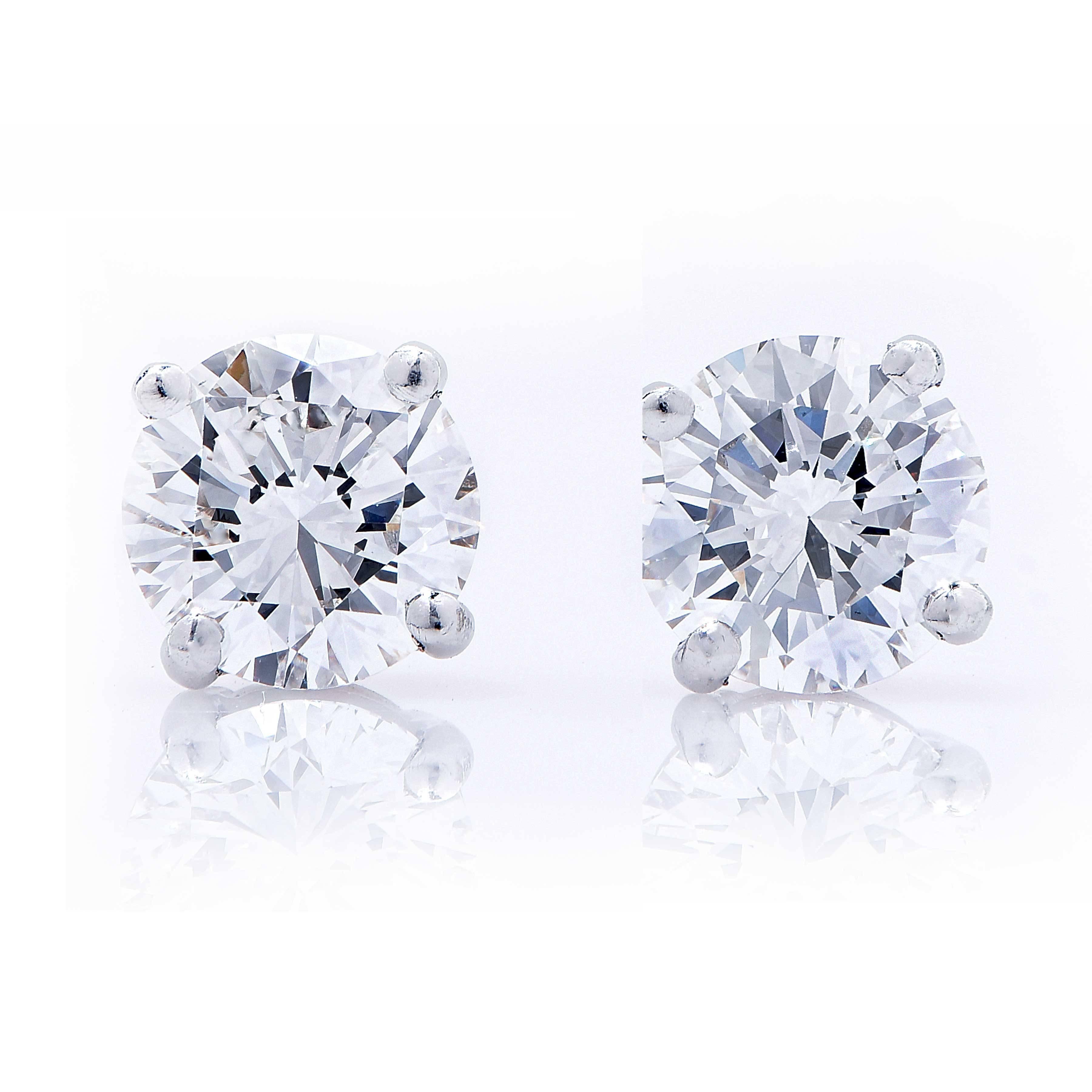 Diamond stud earrings set with 2 GIA certified G Color VS1 clarity round brilliant cut diamond weighing a total of 2.64 carats. They are set in platinum with locking backs to keep them securely on. 