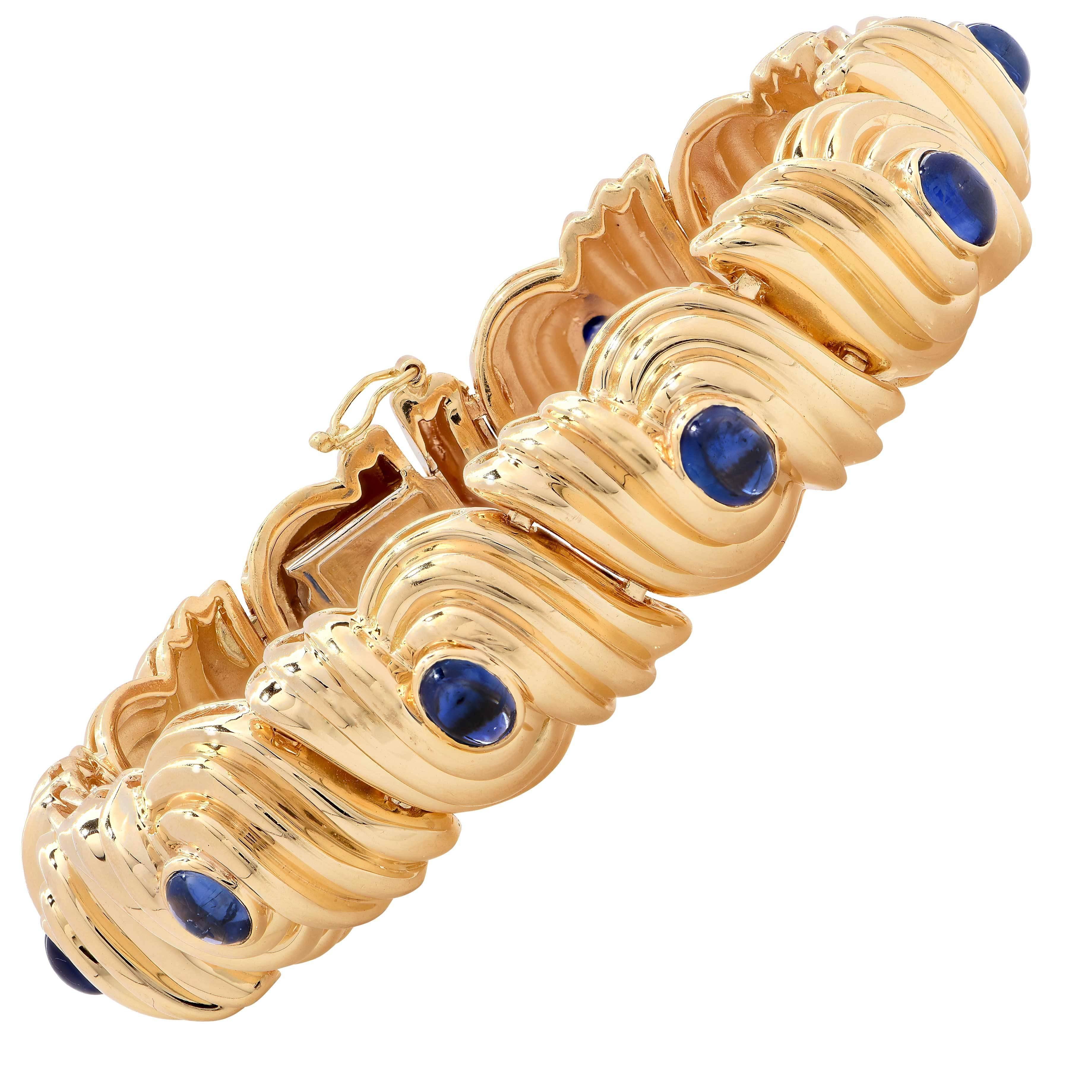 1980's Retro Design Gold bracelet set with 10 oval cabochon sapphires weighing approximately 5 carats.
Length 6 3/4 inches

Metal Type: 18 KT Yellow Gold
Metal Weight: 74.6 Grams 