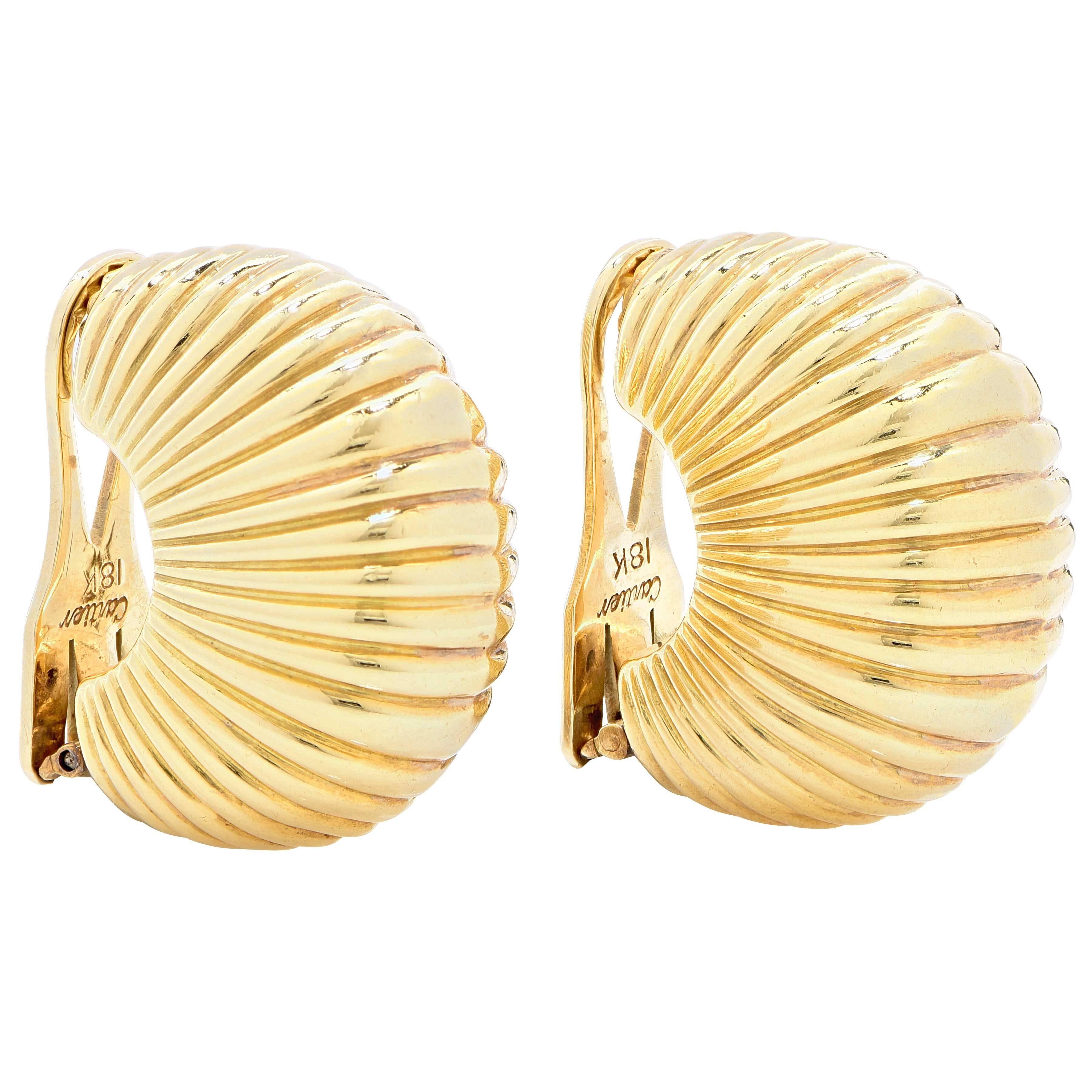 Highly stylized shell ear clips.