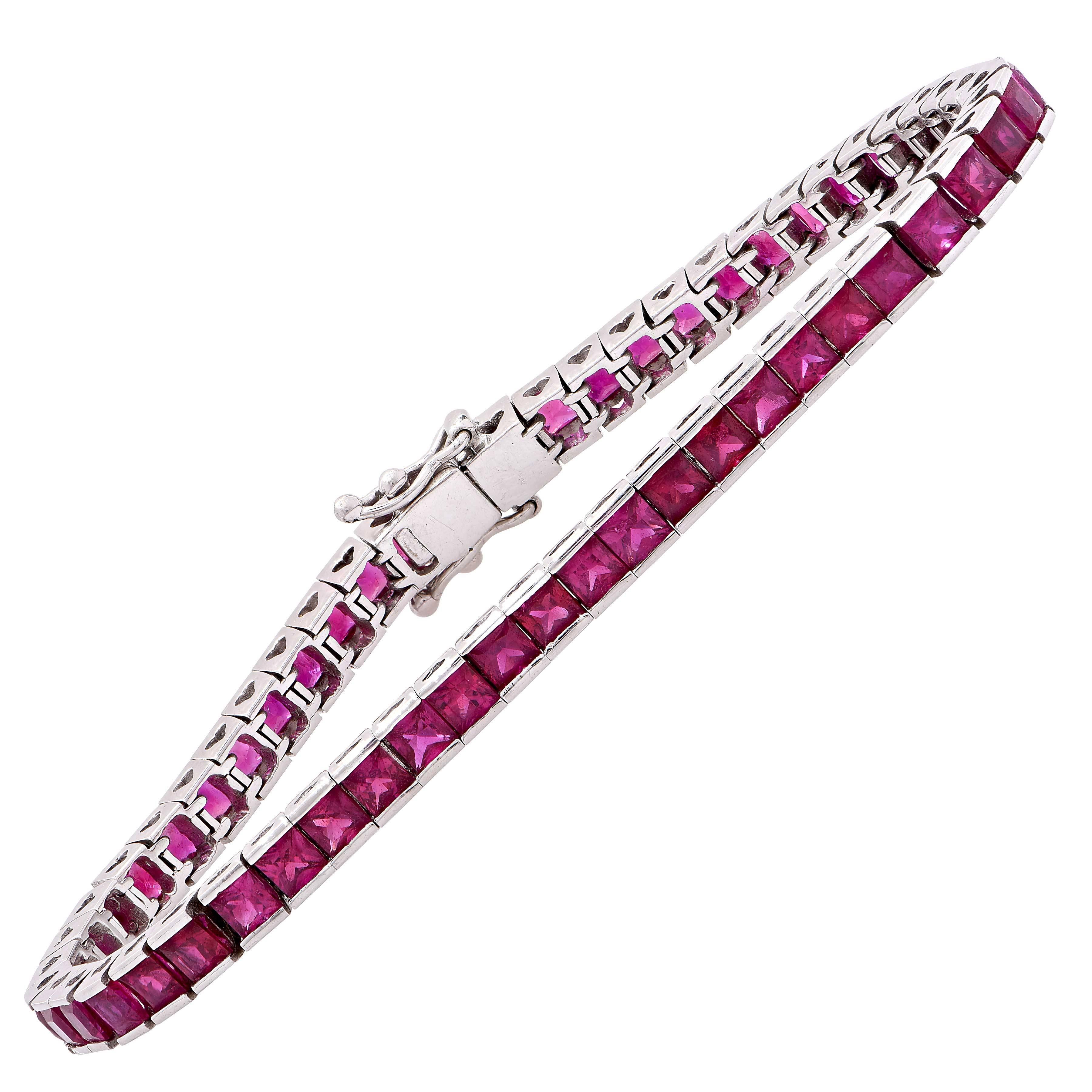 Ruby straight line bracelet set with 46 rubies weighing approximately 9.35 carats.

Metal Type: 18 KT White Gold
Metal Weight: 