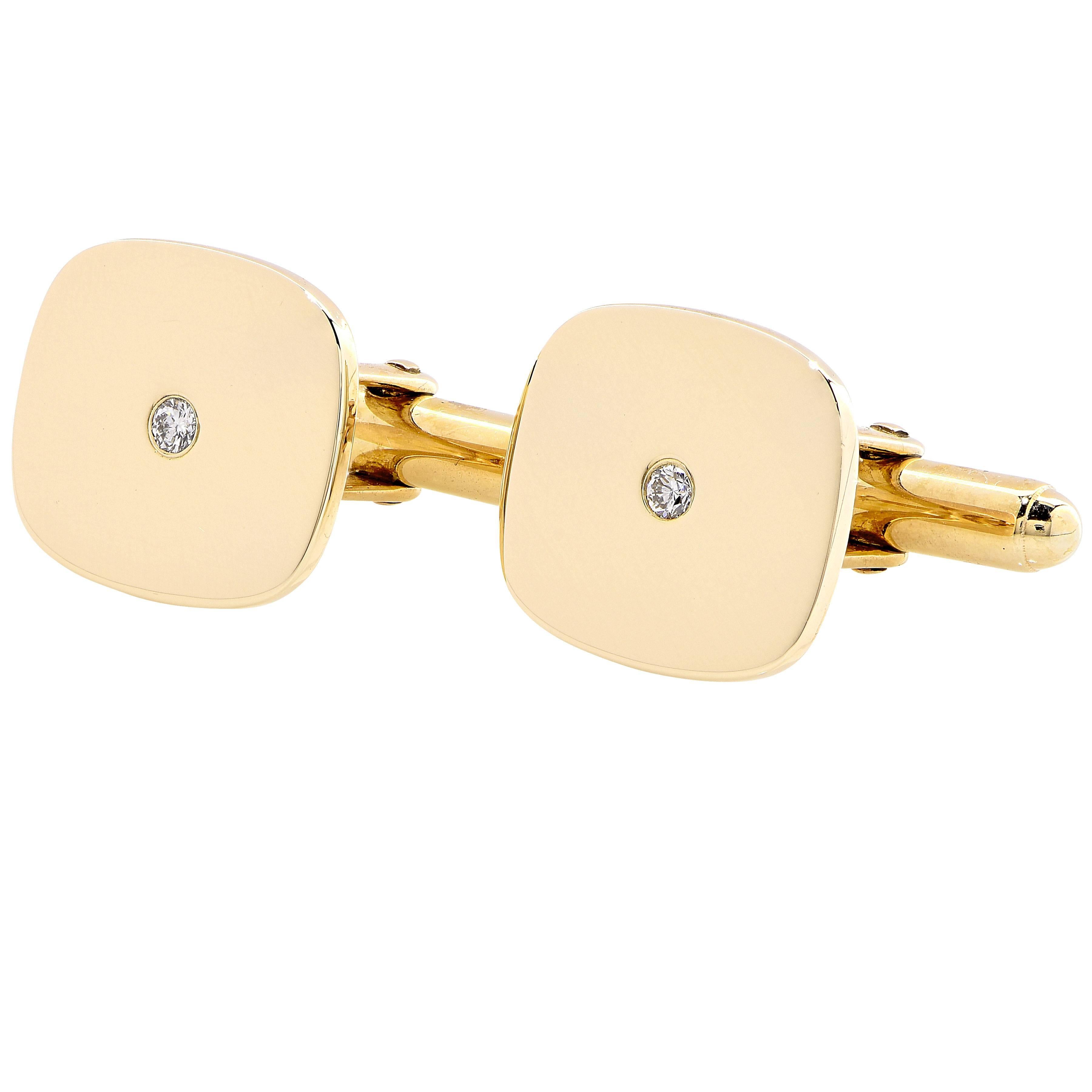 Gold cuff-links set with a single diamond.

Metal Type: 14Kt Yellow Gold
Metal Weight: 12.7 Grams