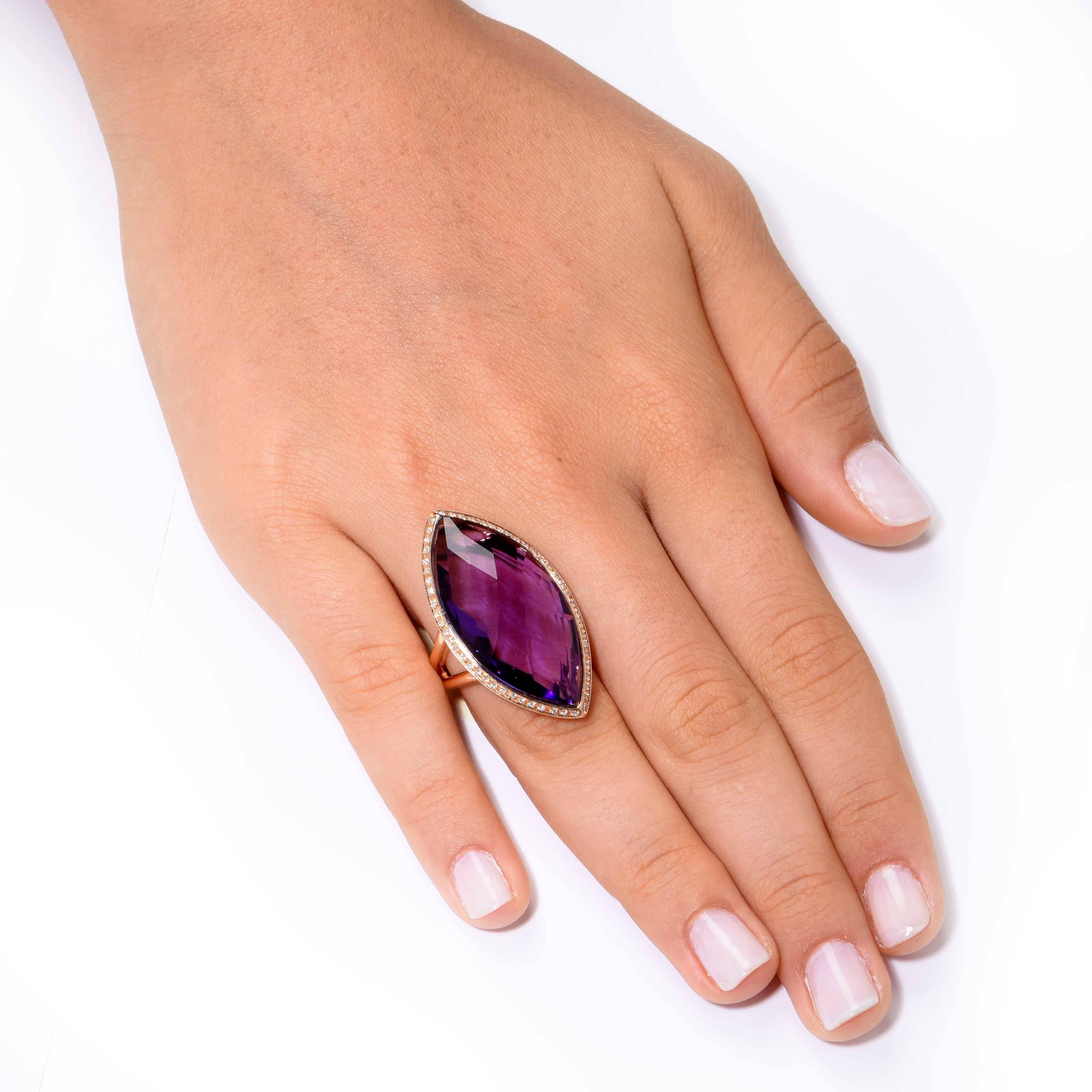 Impressive Italian fashion ring featuring a marquise shaped faceted natural Amethyst, and 54 micro-pave set diamonds weighing 0.20 carats. 

Ring Size 6 3/4 (Can be sized)
Metal Type: 18 KT Rose Gold (stamped and/or tested)
Metal Weight: 15.6 Grams 