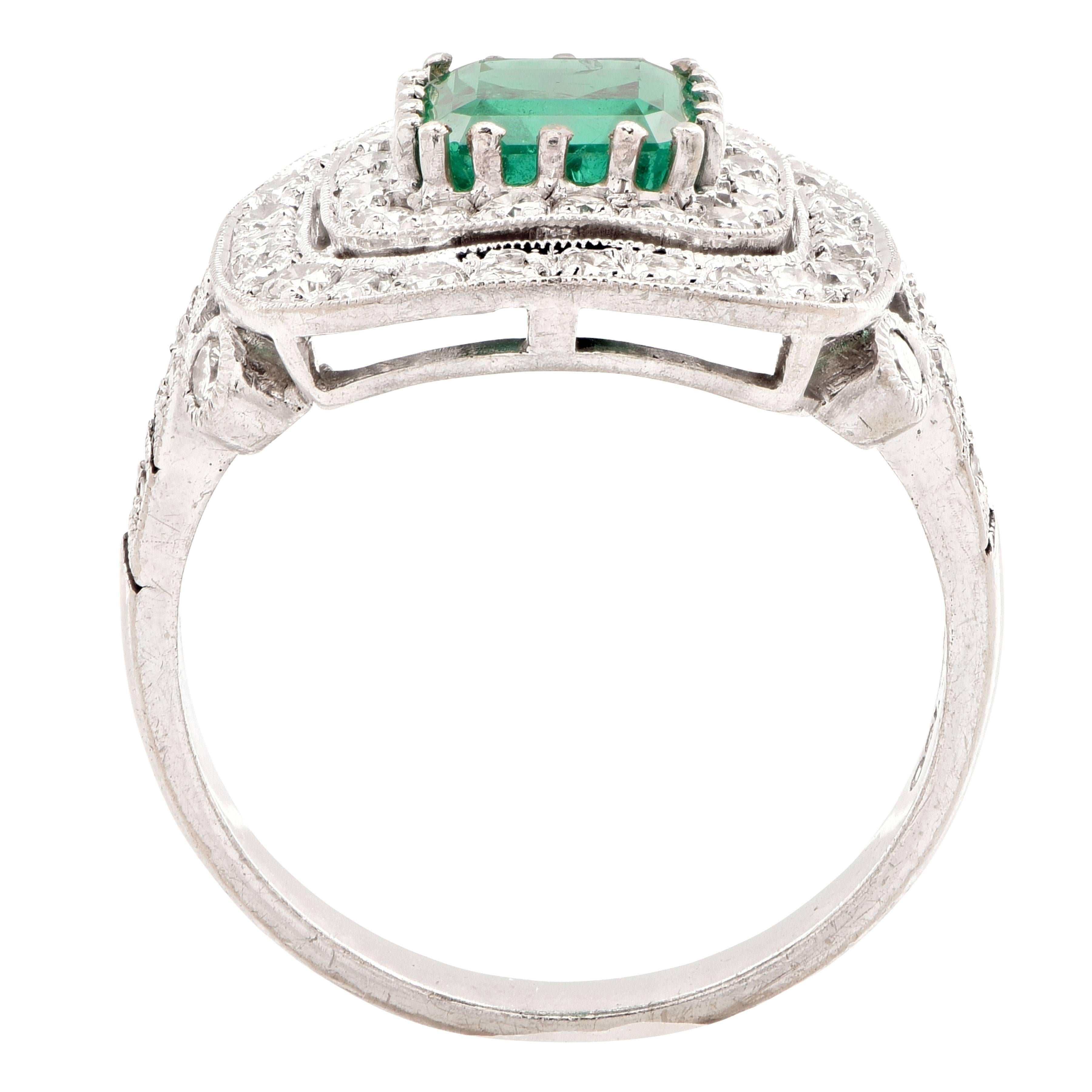 Modern 1.5 Carat Emerald and Diamond 18 Karat White Gold Ring